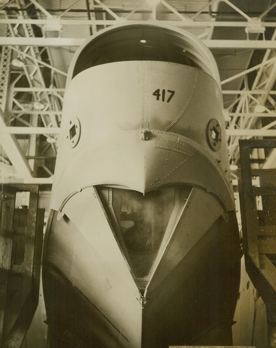 Where Mariner Patrol Bombers Are Built, 10/4/1943. Baltimore, MD—Here is a view of the nose of a huge martin (illegible word) mariner patrol bomber, looking like the head of a bird of prey. The ship is shown on the final assembly line of the Glenn L. Martin plant in Baltimore. (Passed by U.S. Navy censors). Credit: ACME.;