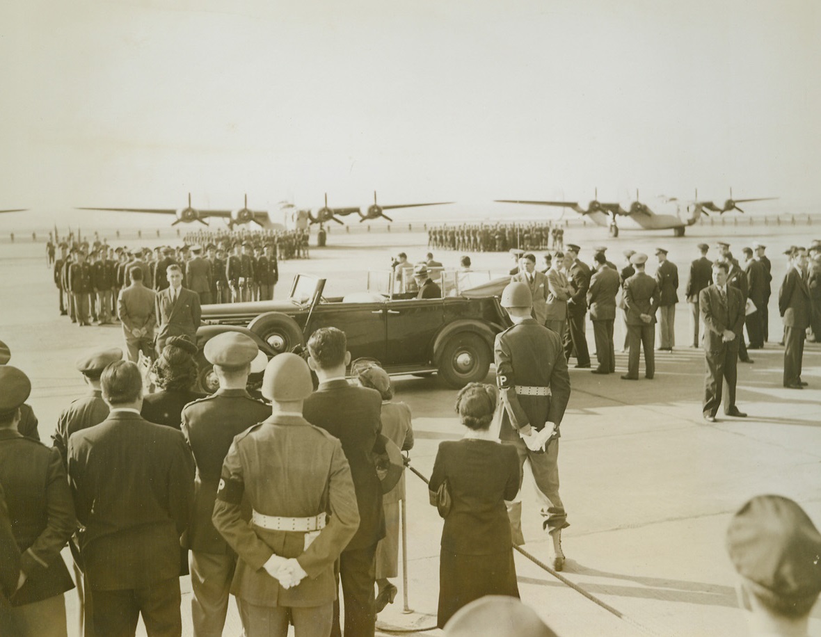 First Yugoslavian Combat Unit Activated, 10/7/1943. Washington, D.C. -- Activation of the first Yugoslavian combat unit in the Army Air Force took place with the dedication At Bolling Field, Washington, of four B-24 Liberator Bombers, and their delivery to the American-trained Yugoslavian combat crews. President Roosevelt watched the ceremonies from his car. Crews and planes, which took off for Europe after the ceremonies, can be seen in the background. Credit: ACME;