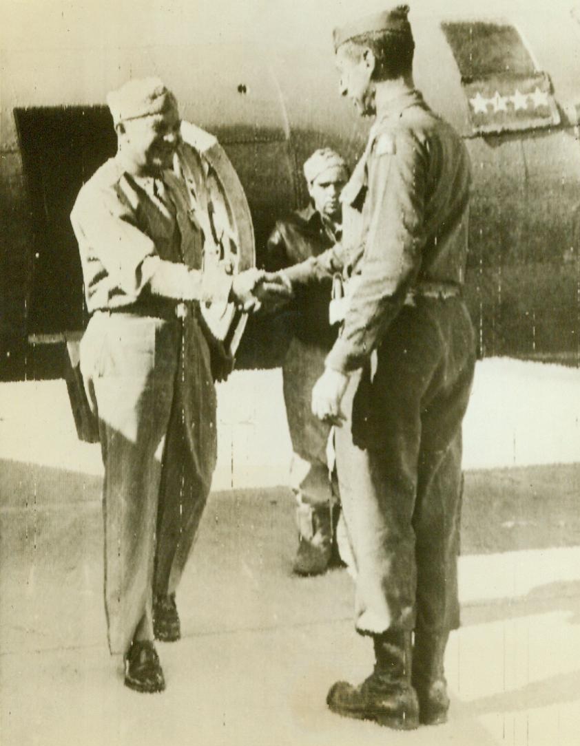 General Ike Visits Italy Front, 10/25/1943. Italy—General Mark W. Clark (Right), Commander of the Allied 5th Army, greets General Dwight D. Eisenhower, Commander-in-Chief of Allied forces, who arrives at the Naples airport for a tour of the Italian battlefront. Probably words of congratulation are on the lips of “General Ike” for the thorough job being accomplished by Clark’s troops in beating back the Germans. 10/25/43 (ACME Raidotelephoto);