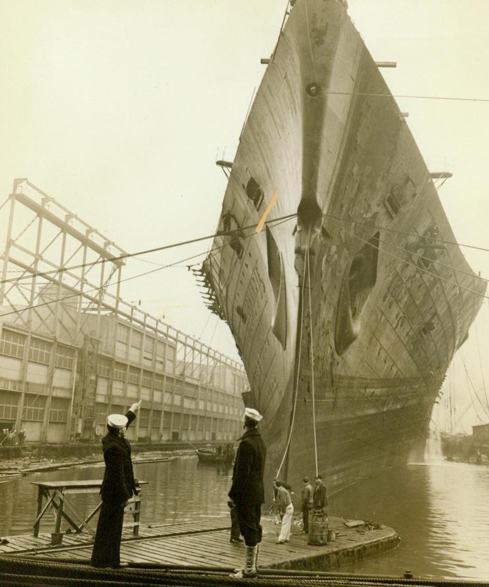 On Even Keel, 10/27/1943. New York: - The U.S.S. Lafayette, the former luxury liner Normandie which burned and capsized at its pier in the North River Feb. 9, 1942, is on even keel again. And in fitting ceremonies, the ship was turned over to the Navy, Oct. 27, by Merritt, Chapman & Scott; salvage contractors, for refitting in dry dock. Cost of salvage operation was four and a half million dollars.  10/27/43 (ACME);