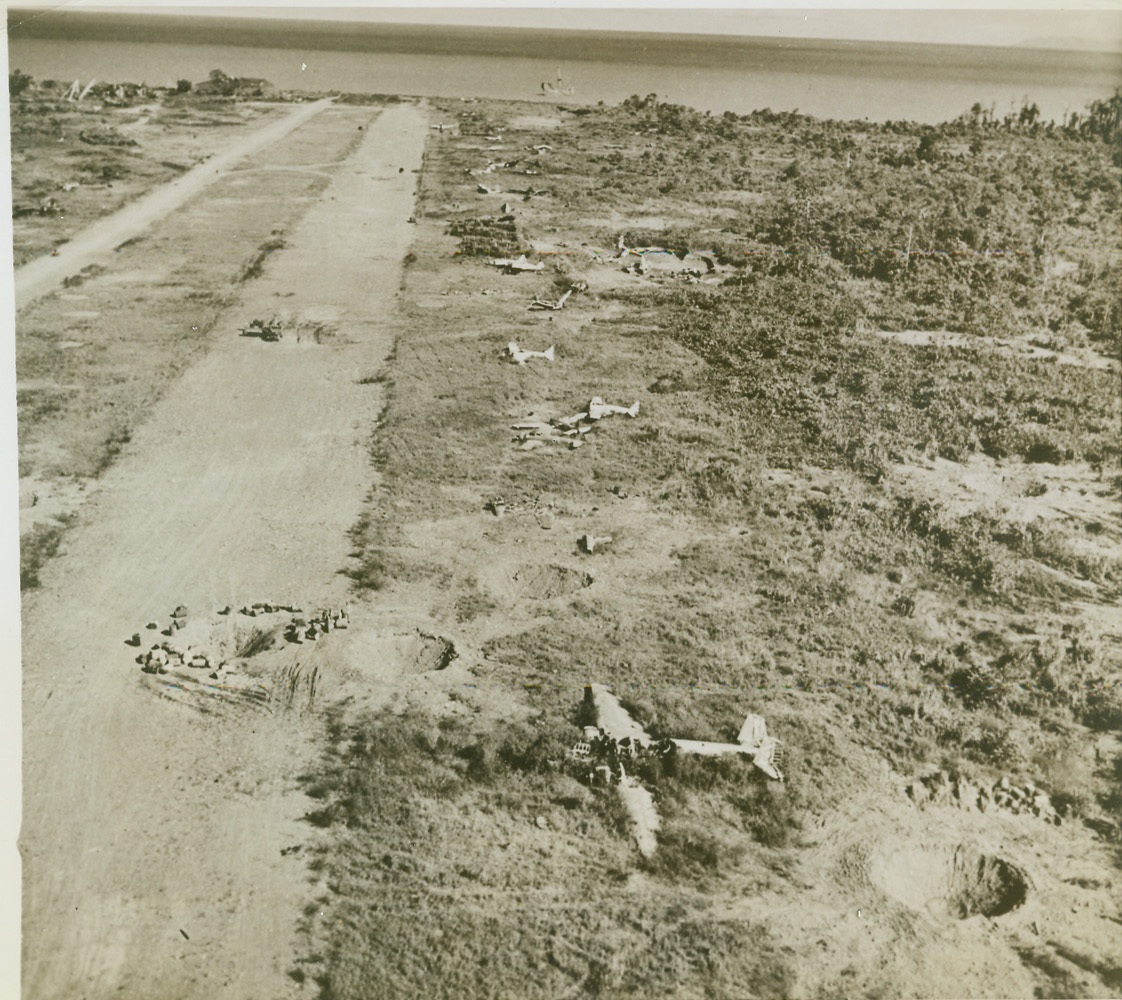 Graveyard for Jap Aircraft, 10/29/1943. NEW GUINEA - Bits of wrecked enemy planes litter the beach at Lae, New Guinea, where they were bombed by American aircraft. Huge bomb craters are visable in the area now held by American and Australian forces. The damage to Jap installations and war equipment was done by Yank planes and Aussie artillery.;