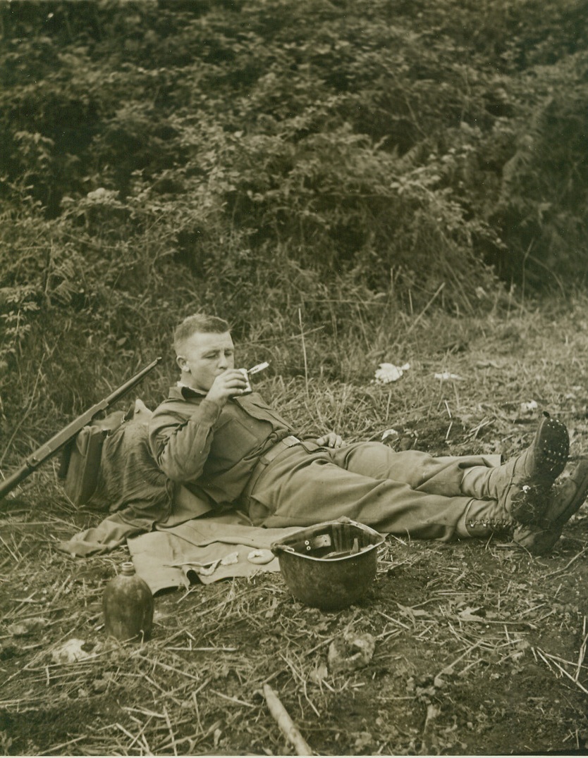 Some Like It Cold, 11/8/1943. ITALY – Though many members of a U. S. infantry regiment making a half-hour stop for lunch near Pietravairano heated their rations before having their noon-time meal, Sgt. James Schwartz, Lorane, PA., preferred to have his food cold.  He drinks some cold chocolate beverage which he’s mixed in a empty C-ration can, the contents of which he’s just eaten cold.Credit—WP—(ACME PHOTO by Bert Brandt, war pool photographer );