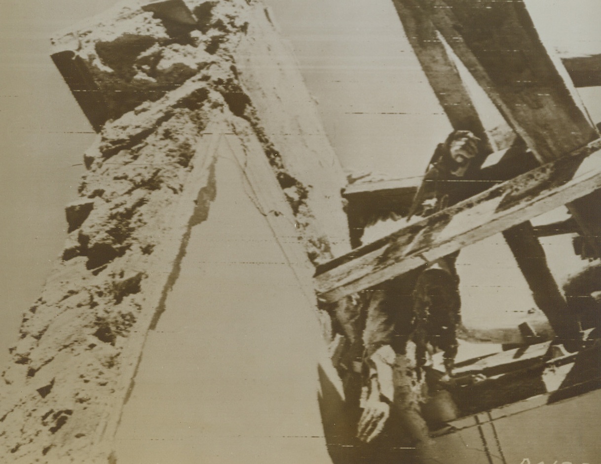 Death on the Rafters, 11/6/1943. ITALY—An Italian citizen of Prata paid for a good night’s sleep with his life when the Nazis exploded a road block. Advancing Allied troops found his body hung on the rafters. The night before he had gone to bed on the second floor of his home. Credit: ACME photo via SIGNAL CORPS RADIOTELEPHOTO.;