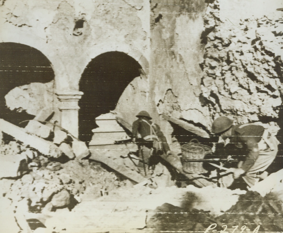Sniper Hunt in Italy, 11/15/1943. This photo, flashed to the United States by radiotelephoto today, shows British riflemen advancing cautiously through the wreckage of an Italian town, looking for snipers and machine gun nests. Credit: U.S. ARMY RADIOTELEPHOTO from ACME.;
