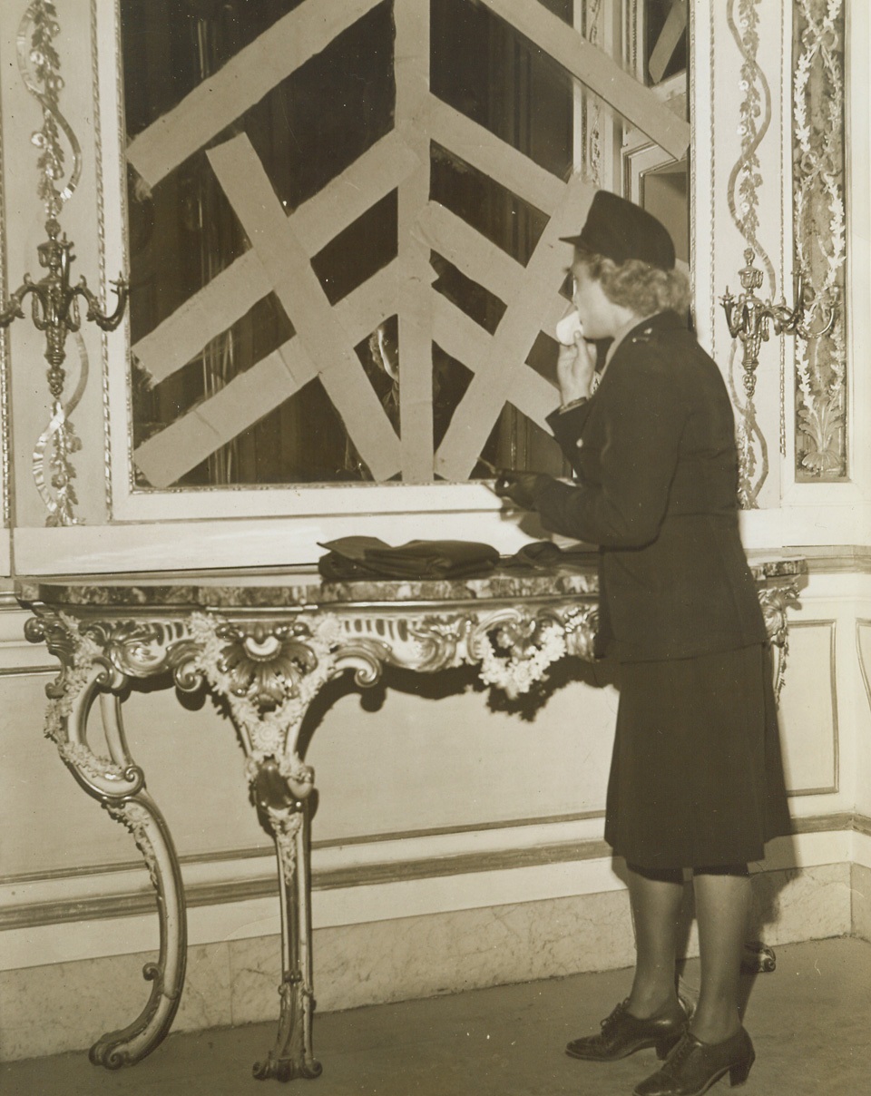 Queenly Operation, 11/17/1943. NAPLES—Taped to prevent damage during bombing raids, the mirror in the Queen’s powder room at one of the royal palaces in Naples serves Lt. Wilma Ward, Army nurse from Birmingham, Mich., as she freshens her makeup, in much the same manner as many Italian queens powdered their noses in the past. Credit: WP photo by Bert Brandt ACME Correspondent.;
