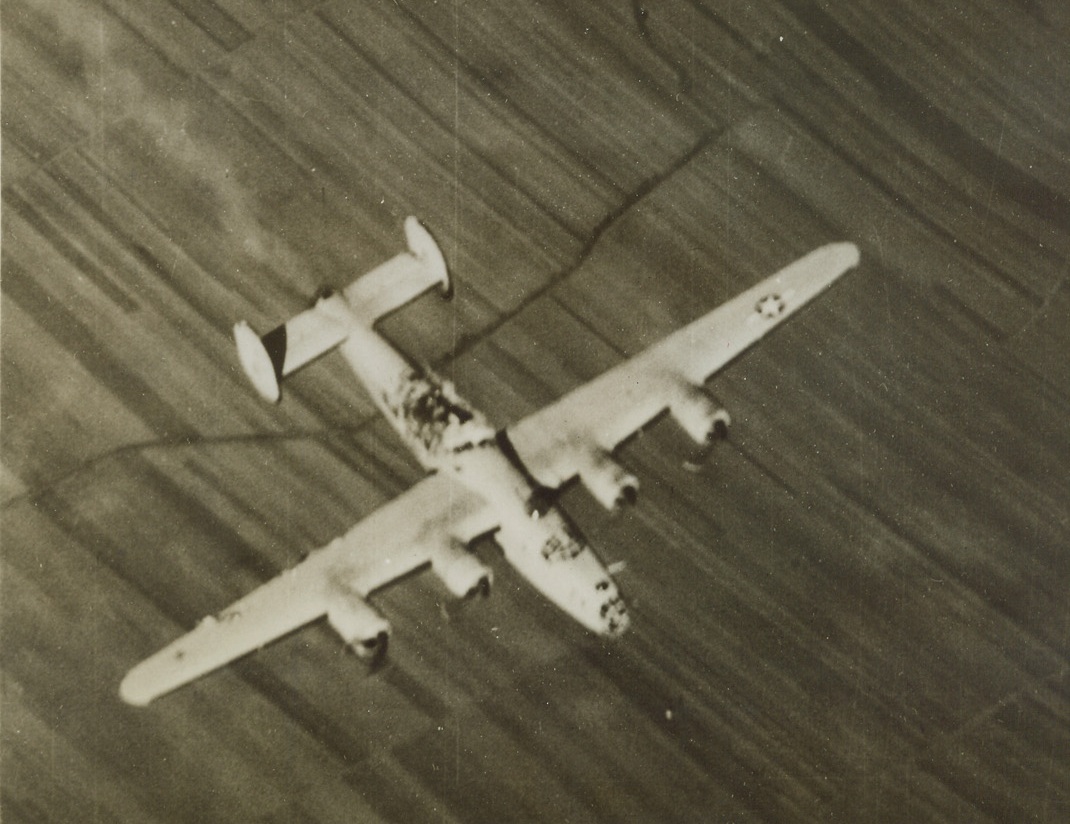 Torn by Enemy Flak, 11/16/1943. Enemy flak tore a five foot by thirteen foot gap in the fuselage of this American Liberator, as it accompanied other bombers in the Nov. 2nd raid on the German Messerschmitt Airplane works near Vienna, only 550 miles northeast of Naples. Mortally, wounded, the Liberator fell shortly after this photo was made.Credit (U.S. Army Air Forces Photo from ACME);