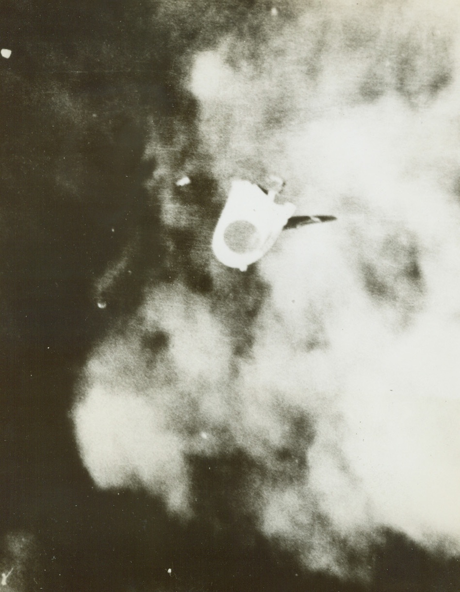 Japs Loses to Liberator, 11/8/1943. Somewhere in the Pacific – Trailing black smoke and flame from her starboard outboard engine, a Jap four-motored “Mavis” flying boat starts its final glide downward after losing in a dogfight with a U.S. Navy consolidated Liberator PB4Y patrol bomber, “somewhere in the Pacific.”  This photo, released by the Navy Department today, was taken during the fight last August by a photographer aboard the victorious Liberator.Credit Line (Official U.S. Navy photo from ACME);