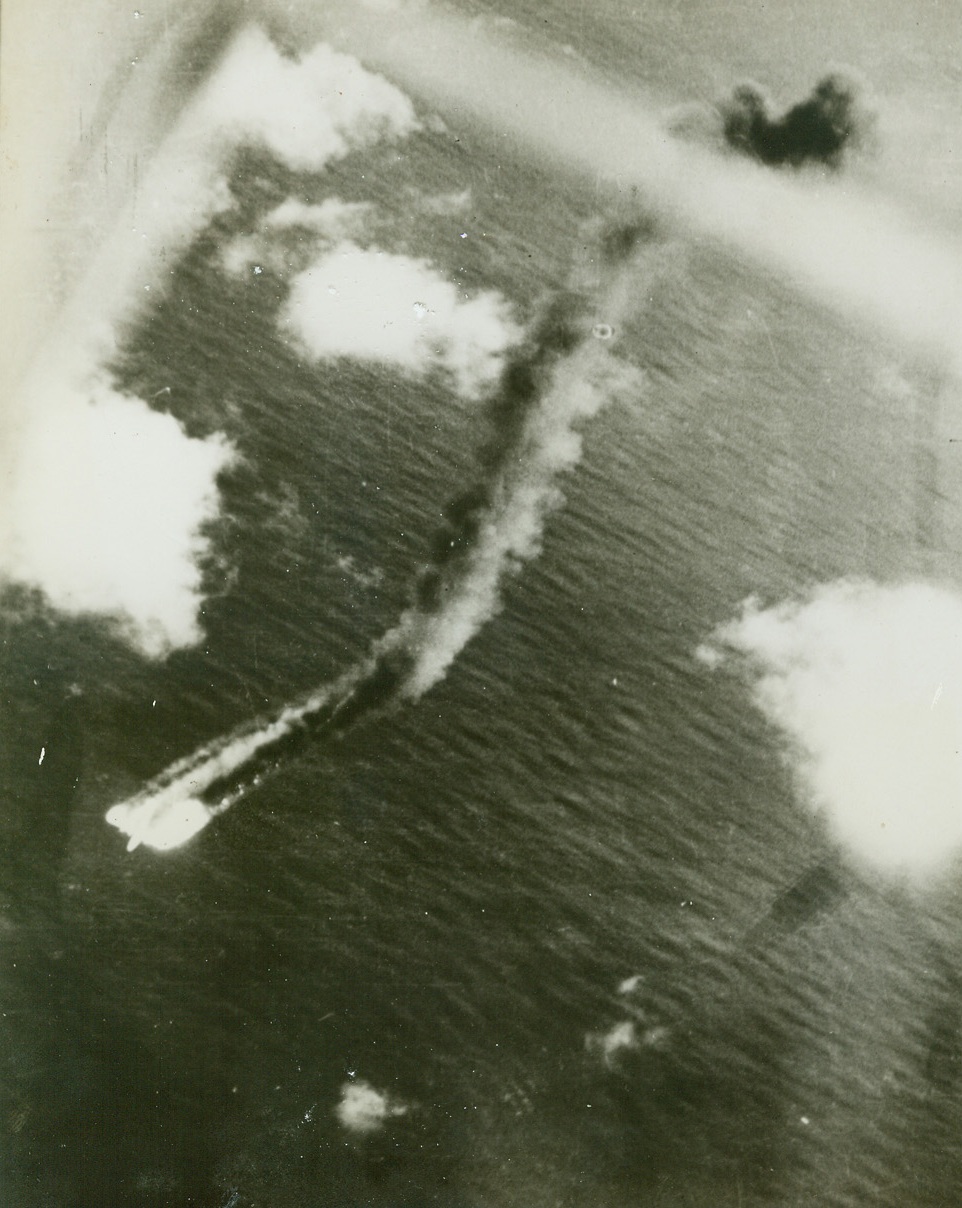 Jap Loses to Liberator, 11/8/1943. Somewhere in the Pacific – Wrapped in flames, which trail out behind twice the length of the fuselage, a huge Jap “Mavis” four-engined flying boat nears the surface of the sea after an unsuccessful dogfight with a U.S. Navy PB4Y consolidated Liberator patrol bomber, “somewhere in the Pacific.”  This photo, released by the Navy Department today, was taken from the victorious Liberator during the battle last August.  The American plane followed the doomed nip down to get photos of its death dive.Credit Line (Official U.S. Navy photo from ACME);