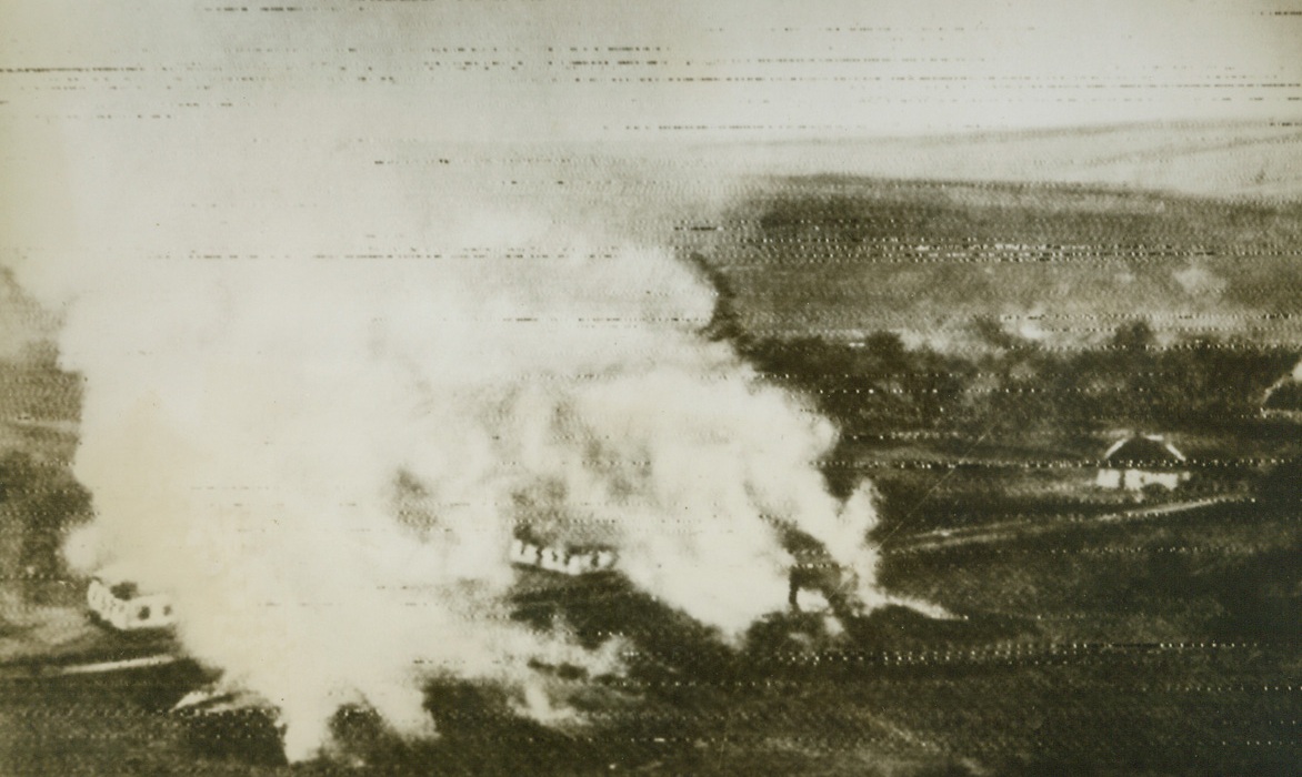 Nazis Still Using Scorched Earth Policy, 11/6/1943. RUSSIA—Before reorganizing their lines, the Nazis set this village ablaze in the Krivoi Rog district, in the Dnieper Bend. The Germans are believed to have withdrawn great numbers of troops from fallen Kiev to bolster their lines at Krivoi Rog, the still embattled city in southwest Russia.Credit: ACME;