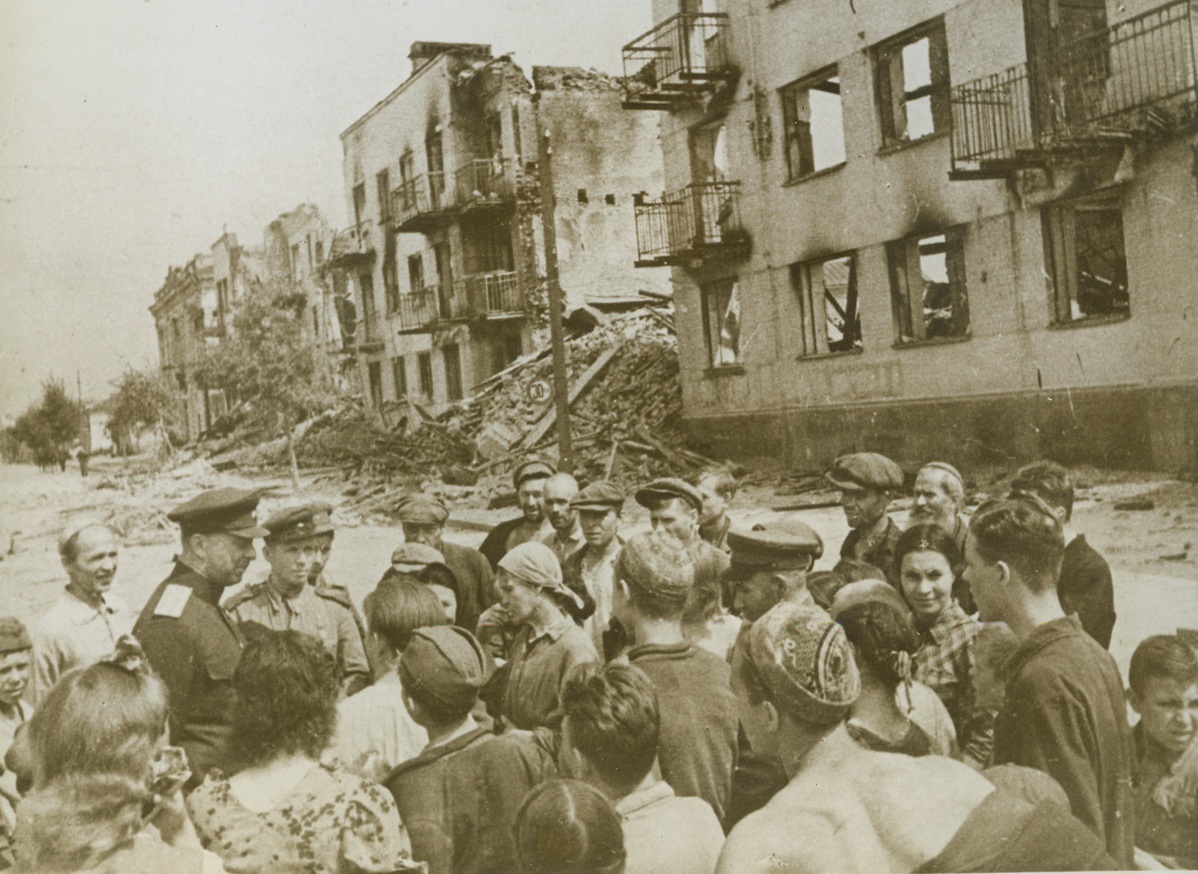 After Nazi “Locusts” Passed, 11/10/1943. OREL, RUSSIA—A Soviet General talks with residents of Orel, who had returned to the gaunt, fire-blackened skeletons of what had been their homes after the retreating Germans had abandoned the city. Passed by censors. Credit: ACME;