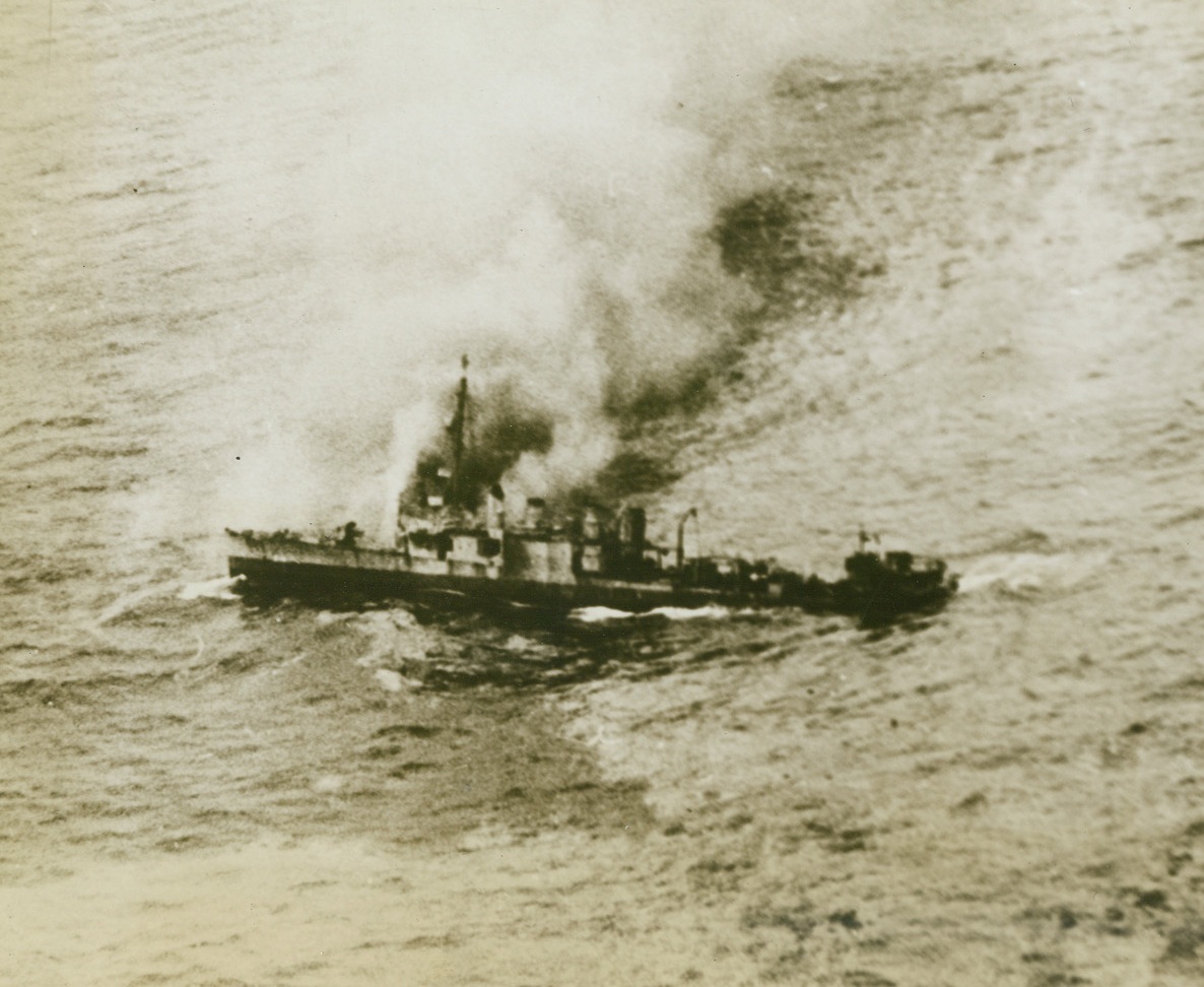 A Gallant Fighter Goes Down, 11/16/1943. On the Atlantic—Smoking badly from internal fires, listing badly and down by the stern, the gallant old four-stacker destroyer, USS Borie, is shown just before she was sunk by torpedo bombers from the escort aircraft carrier USS Card. The Borie, the day before had blasted one Nazi sub to the bottom, while acting as an escort to the Card, and then rammed a second enemy U-Boat. The collision opened her seams and, the next day, her skipper, Lt. (now Lt. Comdr.) C.H. Hutchins gave the order to abandon ship. Credit: U.S. Navy official photo from ACME.;
