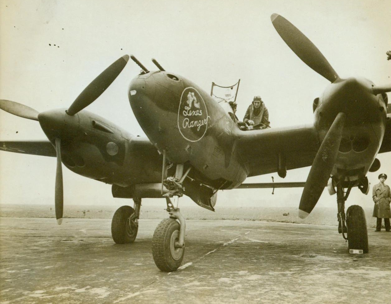 All Duty U.S. Plane In Britain, 11/1/1943. England – The lightning P-38, one of the most useful of all types of U.S.A.A.F. planes, now operates from bases in Britain. Lt. Col. Jack S. Jenkins, of Levelland, Texas, commanding officer of a U.S. Air Force station in Britain, is in the cockpit of his P-38 “Texas Ranger” just before the take-off. The two-engined high-wing monoplane performs many sky war tasks, as it is a fighter-bomber, low-level attack plane, and reconnaissance aircraft. 11/1/43 (ACME);