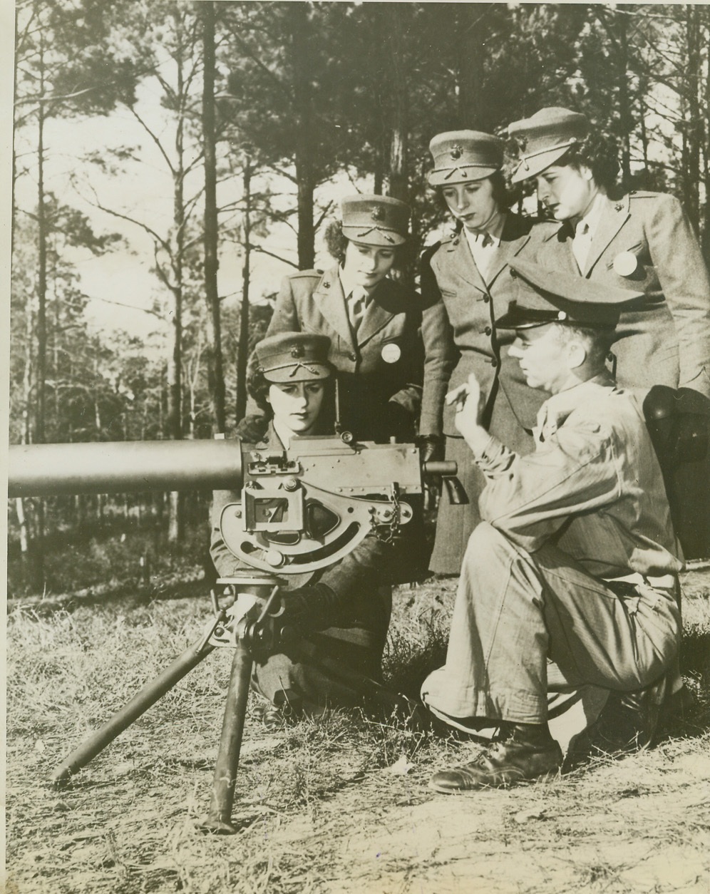 Platoon Sgt. K.L. Smith, (right), USMC, of Cumberland, MD, explains the mechanism, , 12/30/1943.