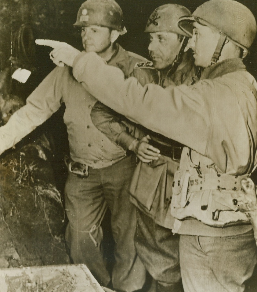 Hunting the Same Prey, 12/11/1943. Italy—An American officer points out the positions of German forces to an Italian commander whose unit has joined Allied fighters in Italy. Lt. Col. Andrew Price, of Fort Worth, Texas, is at left. Today, an Italian general whose troops are fighting alongside American and British units in the Mignano sector charged that the Nazis are executing. All captured Italian officers are traitors. Credit: ACME radiophoto, by Sherman Montrose, War Pool Correspondent, via U.S. Army Signal Corps radiotelephoto.;