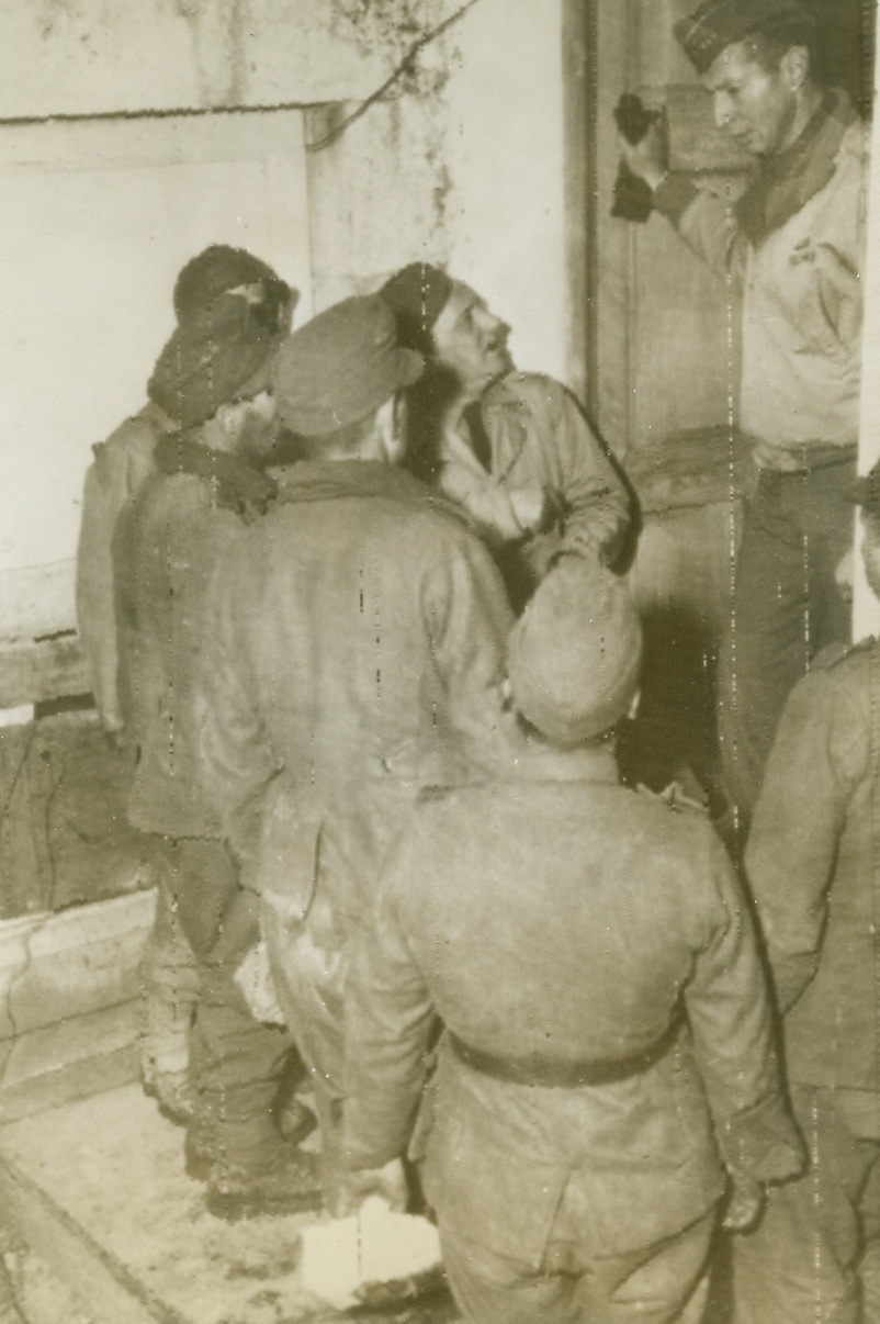 Ready for a “Nice, Friendly Chat.”, 12/28/1943. Italy—General Mark W. Clark is very interested in these guests. They are German prisoners-of-war just brought to headquarters and undoubtedly the Fifth Army Commander will follow the rules of a successful host and ask questions about his guests’ doings rather than talk about himself. Credit: OWI radiophoto from ACME.;