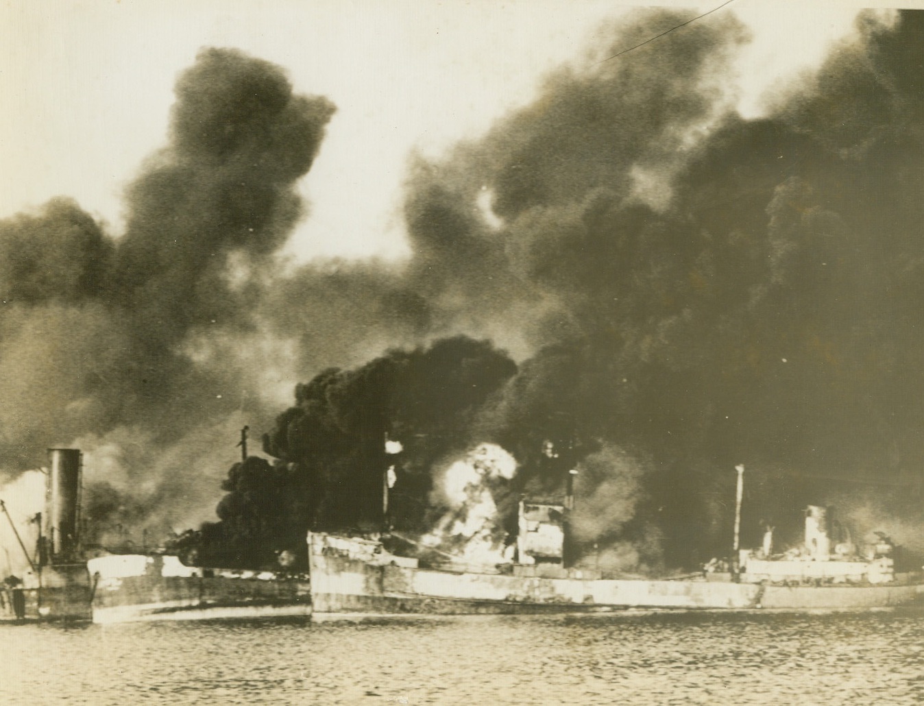 No Title, 12/16/1943. Allied ships burn furiously in harbor at Bari after attack & air raid by Nazi bombers Dec. 2. Most of precious cargo of ships had been removed prior to attack.  U.S. Signal Corps Photo from ACME;