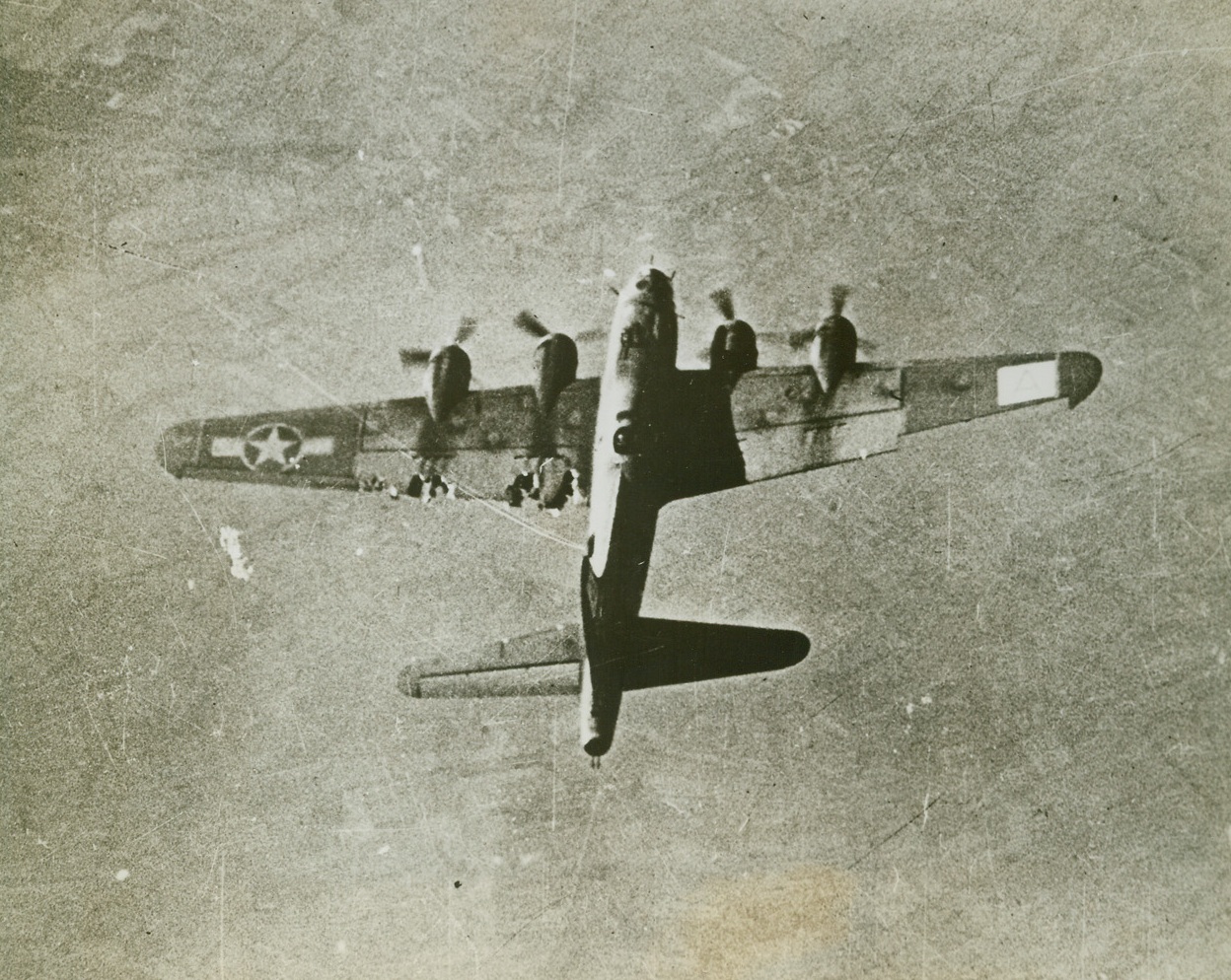 Heading for Gelsenkirchen, 12/31/1943. SOMEWHERE OVER GERMANY—Despite a badly shot up left wing, this flying fortress maintained its place in the formation on the way to bomb Gelsenkirchen, Germany, a vital communications center. This was one of several raids on Gelsenkirchen, which lies 27 miles west of Portmund, on the Duisburg-Hamm Railway.  Credit:  U.S. ARMY AIR FORCES PHOTO from ACME.;