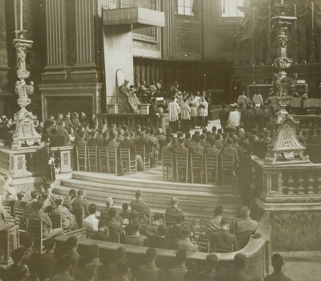 Offering Thanks for Deliverance of Naples, 12/27/1943. NAPLES, ITALY – The sanctuary in the Cathedral of Naples, October 17, when a solemn mass of thanksgiving for the deliverance of Naples was offered by Allied Chaplains of the Fifth Army. His Emminence, Alessio Cardinal Ascalesi, Archbishop of Naples, can be seen on the thrown at left in sanctuary. This is undoubtedly the most colorful ceremony that members of the Fifth Army will have occasion to attend in Naples. Credit (Photo by Charles Seawood, Acme Photographer for the War Pool;