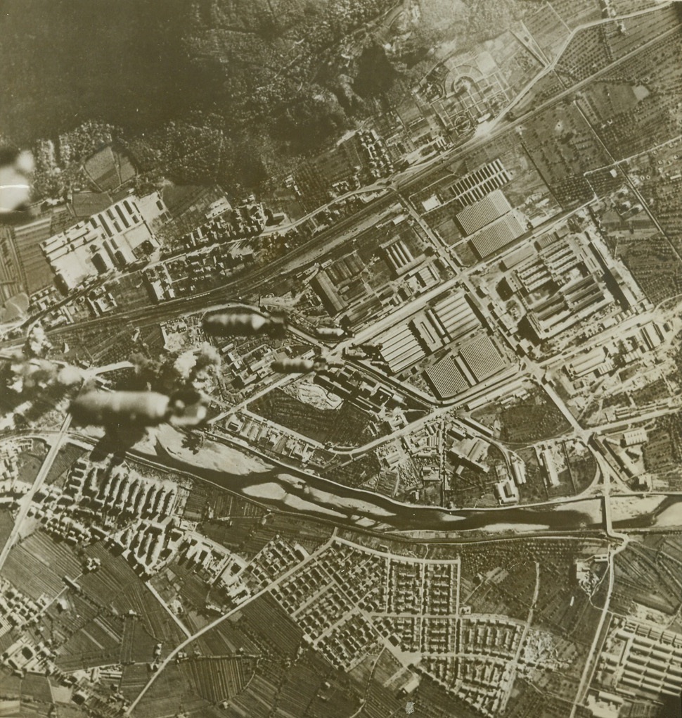 Bombs Fall on Northern Italy, 12/9/1943. Bombs, (lower center in photo), from Flying Fortresses of the U.S. Army Air Forces, fall toward the railway yards and bridges of Bolzano, Italy, during a recent raid on the city which is only 40 miles south of the famous Brenner Pass into Germany. Hits on transportation facilities impaired movement of troops and supplies from Germany to Italy. Credit: (U.S. Army Air Forces Photo from ACME);