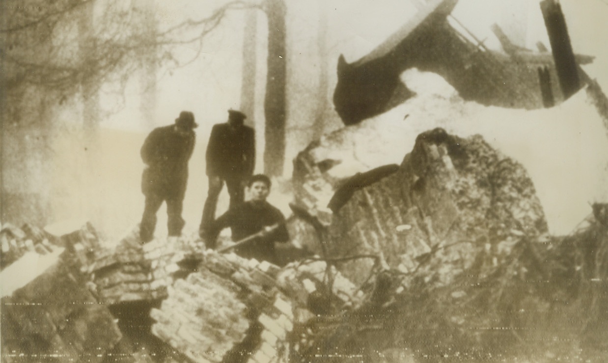 THOROUGH SABOTAGE, 12/20/1943. COPENHAGEN—Here is one of the very few pictures showing sabotage in occupied territory that has been permitted to go through Nazi censorship to Sweden. Workmen are clearing away ruins on a Copenhagen water tower that was blown up by saboteurs on Wednesday at 4 AM. They seem to have done a very thorough job. Photo radioed from Stockholm today. Credit Line (ACME Radiophoto);