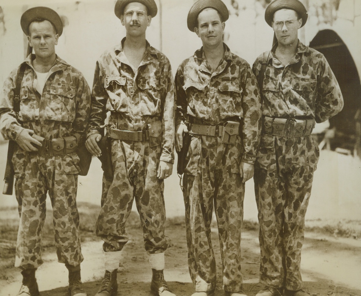Mapped Jap Territory, 12/9/1943. South Pacific – These four U.S. Army Engineers, wear the camouflage suits in which they recently landed on a Jap-held island in the South Pacific, made a 200-mile trip through the island’s jungles, and escaped with material for vital maps and charts. Left to right, are: T/4 John Cahill, of Whitefish Bay, Wis.; T/Sgt. Harold H. Hulseberg, Chicago, Ill.; T/4 Joseph G. Barbre, New Roads, LA.; and T/5 Robert D. Miller, of Weldon, Iowa. (Passed by Censors) Credit: ACME;