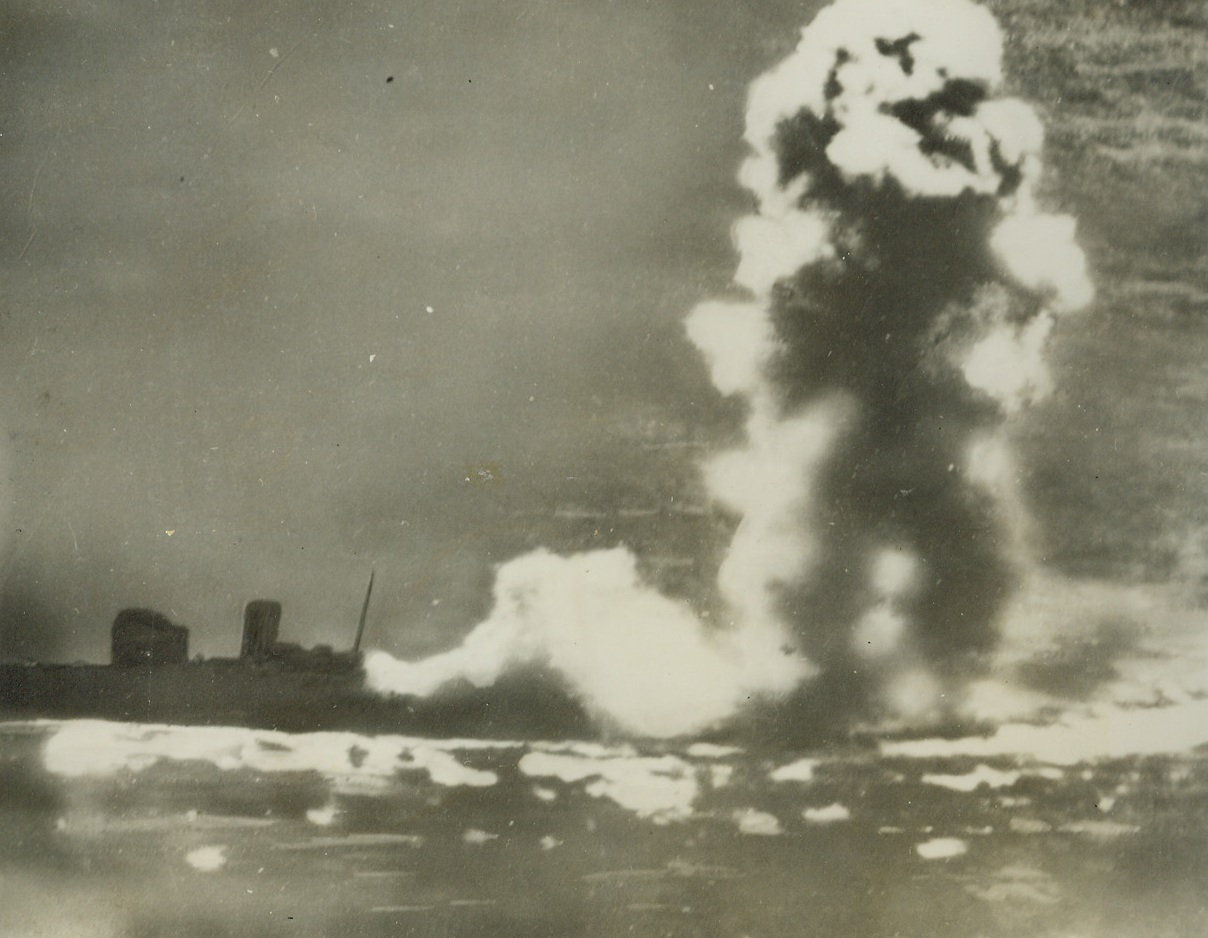 Direct Hit on Nazi Vessel, 12/30/1943. Bay of Biscay – Spotted by American Navy Airmen and sent to the bottom by aircraft of the British Coastal Command, this Nazi Blockade Runner is shown as it suffered a direct hit in the Bay of Biscay. Three of a force of eleven enemy Destroyers accompanied the ship to Davey Jones Locker in the same battle on December 28th. Photo radioed to New York from London today (Dec. 30th). Credit: ACME Radiophoto;