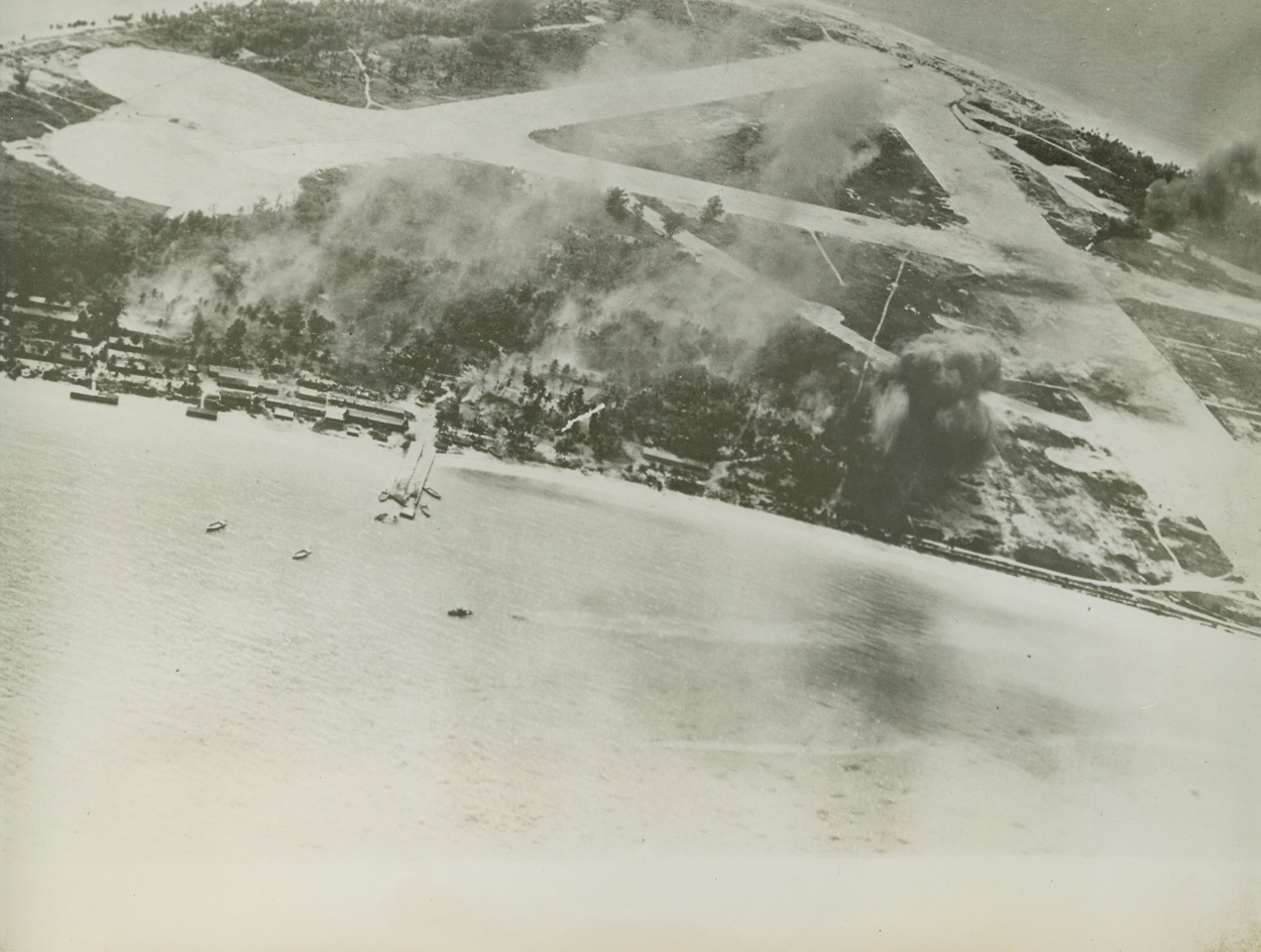 U.S. Bombs Hitting Marshall Islands in Regular Raids, 12/31/1943. Mille Atoll, M. I. – On the regular “milk run” pre-invasion air raids of later, American bombs have been – like here – hitting the air strip and camp area of Mille Atoll in the Marshall Islands. This closeup airview was made during a November raid by Yank fliers. Credit: Official U.S. Navy photo from ACME;