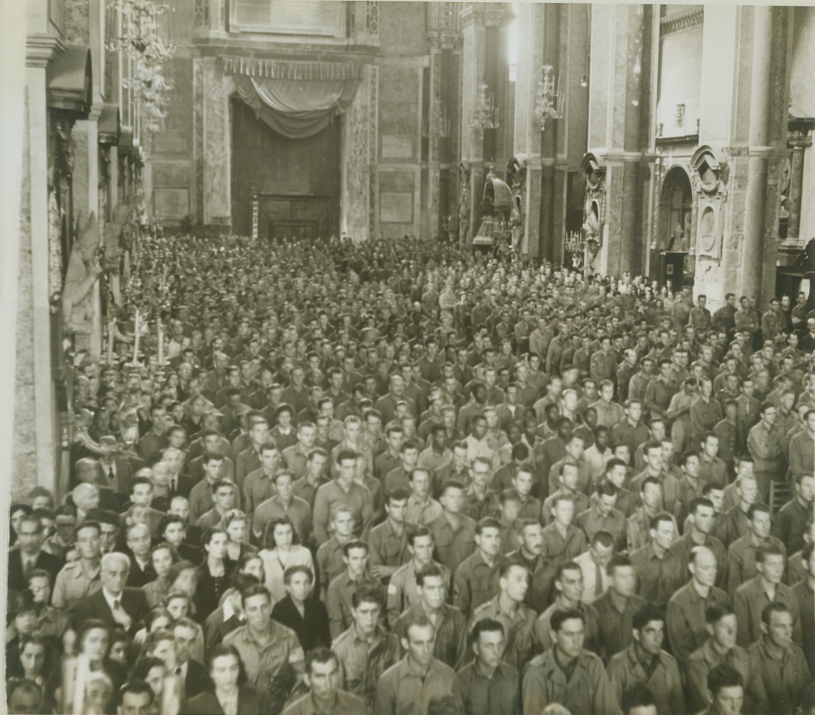 Celebrate Mass of Thanksgiving, 12/27/1943. NAPLES, ITALY -- Every inch of room in the Cathedral of Naples is occupied by a thankful populace and soldiers of liberation during a solemn mass of thanksgiving for the deliverance of Naples, celebrated October 17, by Allied chaplains of the Fifth Army. In attendance, too, was Alessio Cardinal Ascalesi, Archbishop of Naples. Credit (Photo by Charles Seawood, ACME Photographer for the War Picture Pool);