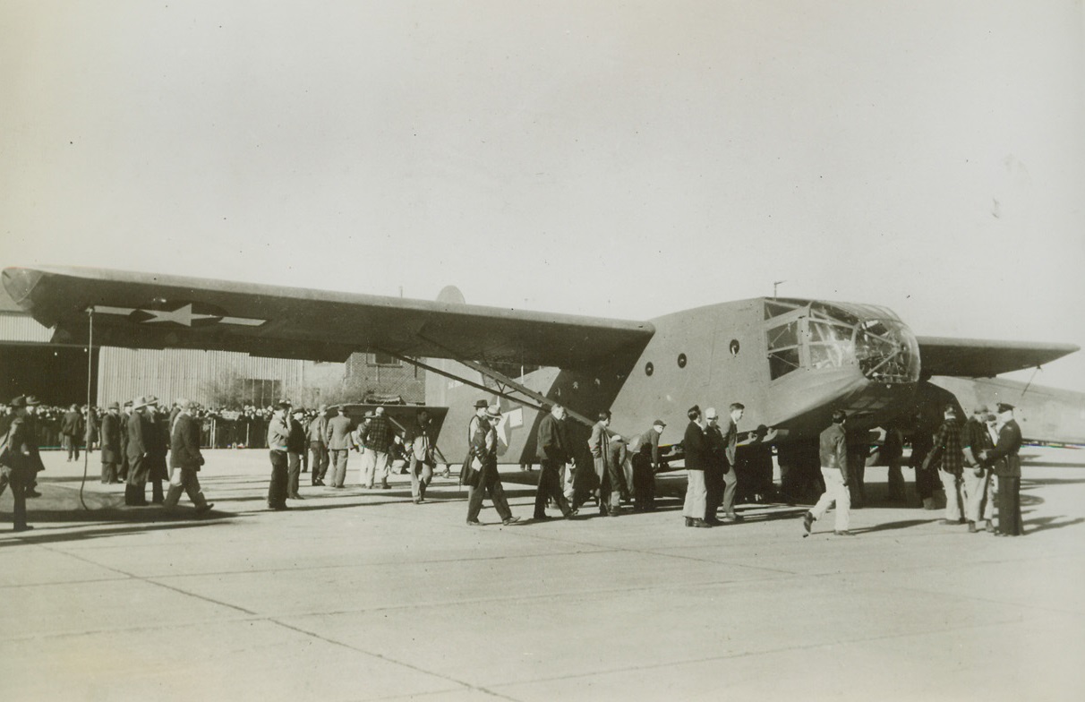 Largest Glider Tested, 12/2/1943.Minneapolis, Minn.—Largest glider ship ever built for Army Air Forces ready for its first test flight at Wold-Chamberlain Field, Minneapolis, Minn. Lt. Col. Bruce B. Price of Wright Field was at the controls of the giant craft with Capt. Ben West as co-pilot. The new ship, under construction since Sept. 24 at the Midway Plant of the Northwestern Aeronautical Corporation, has a load capacity greater than a two-motor Douglas Plane of the type used by commercial lines, factory representative said. Credit: ACME.;