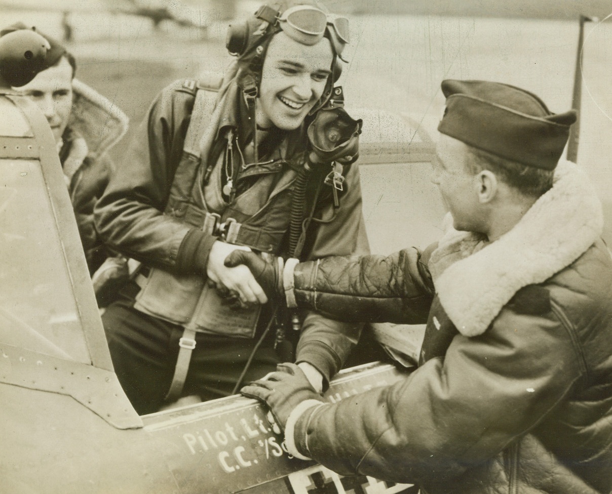 GOOD WORK PAL, 12/16/1943. ENGLAND—Two jubilant fighter pilots greet the new top-scoring ace of the U.S. 8th Air Force fighter command, Capt. Walker M. Mahurin, 24, of 927 West Wildwood, Fort Wayne, Ind., as he returned to his base in England from an escort mission over Bremen.  On the flight he shot down three ME-110s to bring his total score to eleven.  On the following Bremen mission, he increased his tally to twelve.  Credit: U.S. Army Air Forces photo;