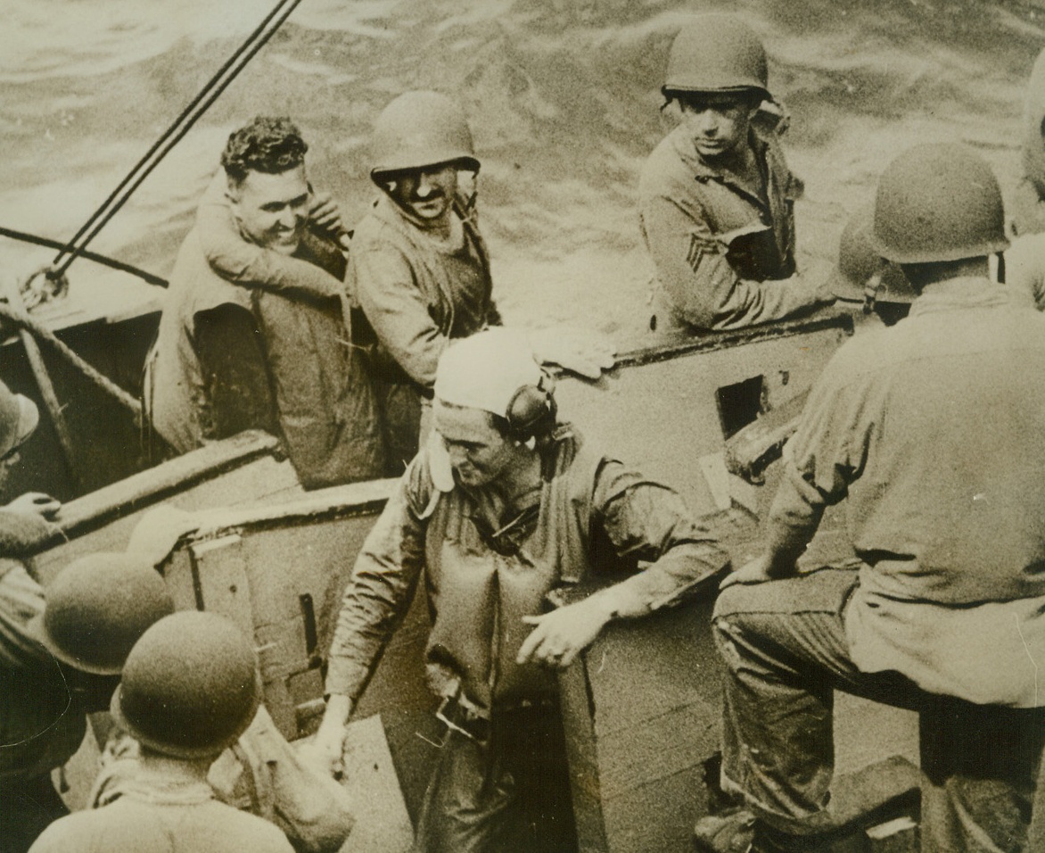 American Pilot Rescued in Solomons, 10/21/1942. This photo, which has just been released and which is from an official U.S. Marine Corps newsreel, shows an American pilot shaking hands with a rescuer, one of the quick-acting U.S. Marines in the group which saved the flier from a watery grave after his plan had been forced down in Solomon island waters during recent fierce fighting there.Credit Line (U.S. Marine Corps photo from ACME);