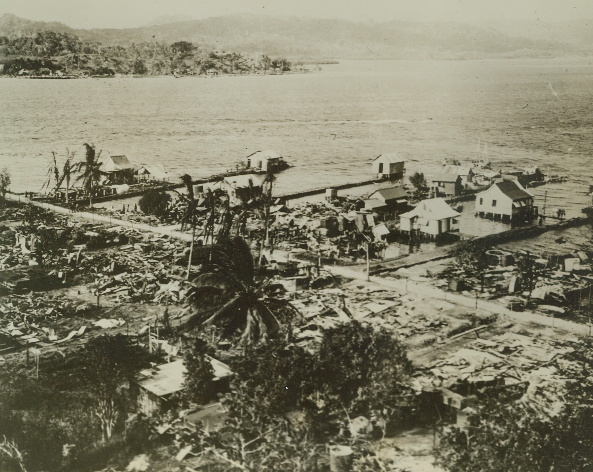 WAR-TORN TULAGI, 10/30/1942. SOLOMON ISLANDS—Bombed and shell-swept, this is the shoreline of Tulagi Island, tiny but strategic member of the Solomon group, where the Jap Navy has deserted after an unsuccessful attempt to dislodge American forces. This photo show damage inflicted by U.S. warbirds before Marines occupied the island during the forepart of the campaign.  Credit (Marine Corps Photo from ACME);