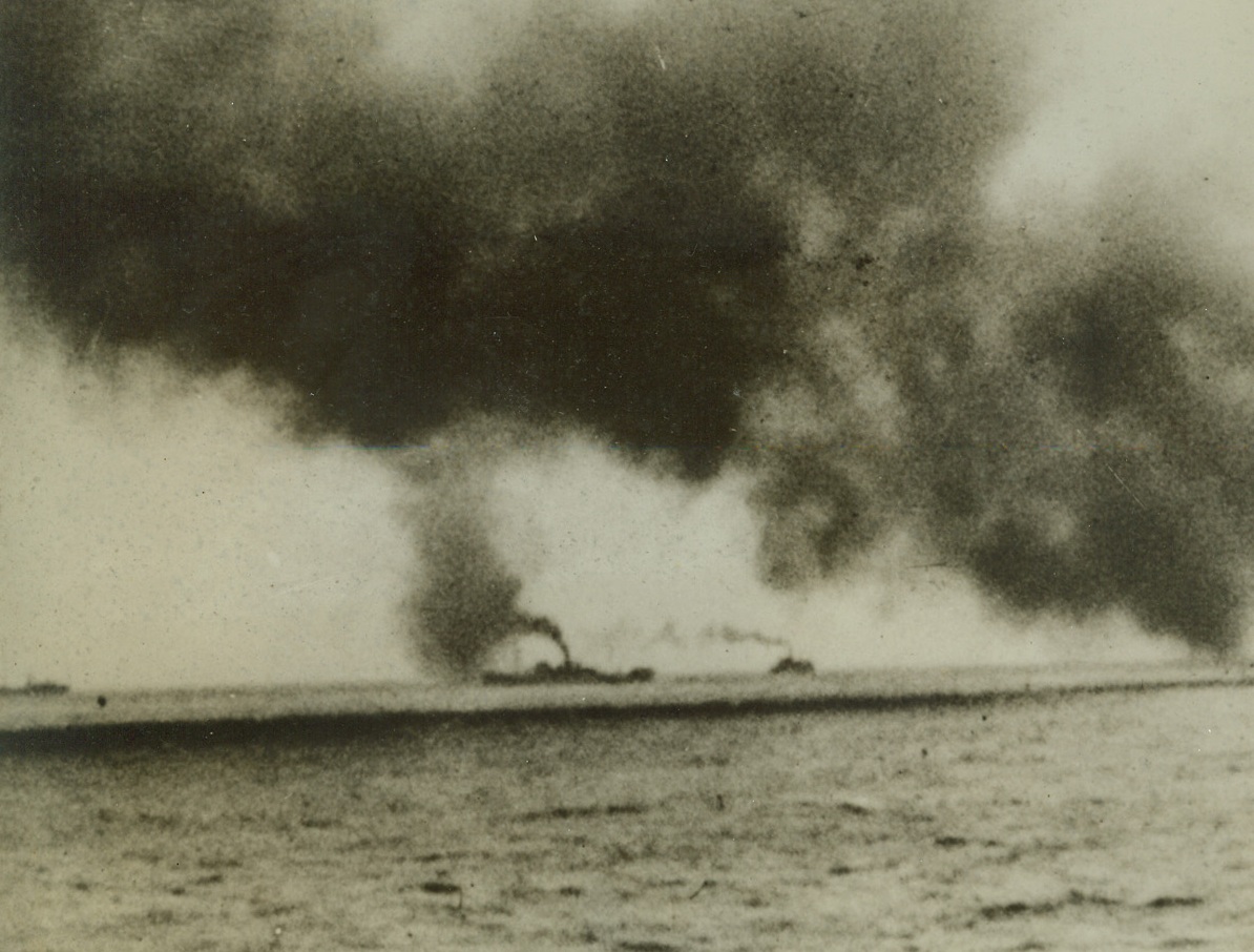CONVOY WEATHERS NAZI ATTACK, 10/9/1942. Merchant ships, drifting along under cover of a smoke screen, manage to complete their voyage to Russia despite four days of constant attack by Nazi torpedo planes and U-boats. The biggest Allied convoy to make the trip to an Arctic port suffered losses but managed to get the greater number of ships safely through. Credit: Acme;