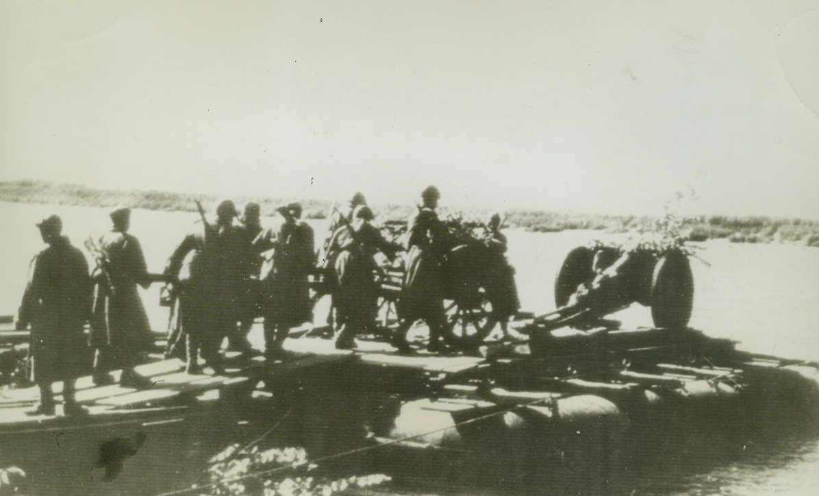 Relief Army Progresses Near Stalingrad, 10/21/1942. RUSSIA—Timoshenko’s relief  army men cross to the western bank of the Don, northwest of Stalingrad. After battering at Nazi lines for ten days they were able to make notable progress. Credit: ACME;