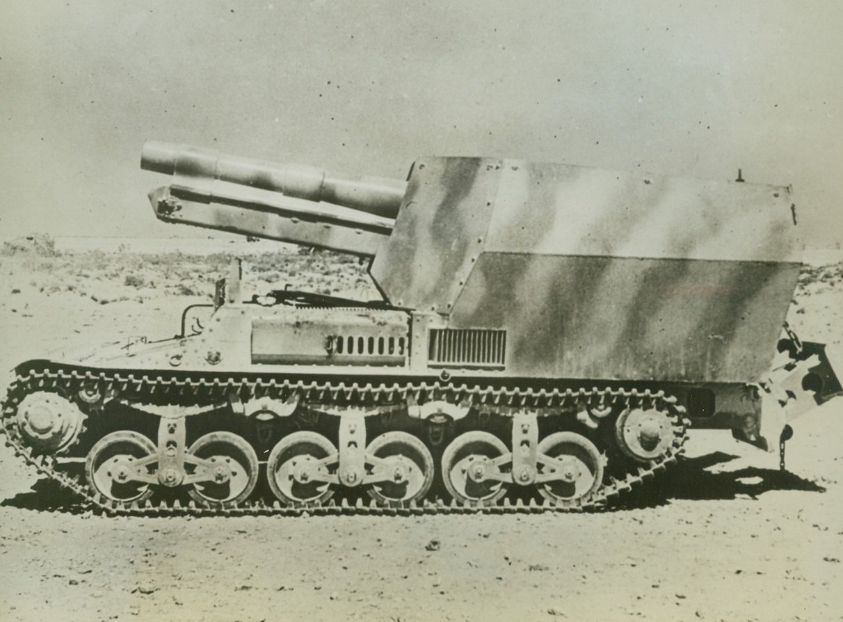 German Mobile Gun Taken in Desert, 10/3/1942. Egypt—This 15-centimeter mobile gun was captured intact from the Axis recently in the Western Desert. Chassis is of French manufacture, possibly having been made in the Renault works which the RAF shattered this summer. Less than 1,000 kilometers were registered on the speedometer when the machine was captured. Passed by British censor. Credit: ACME.;