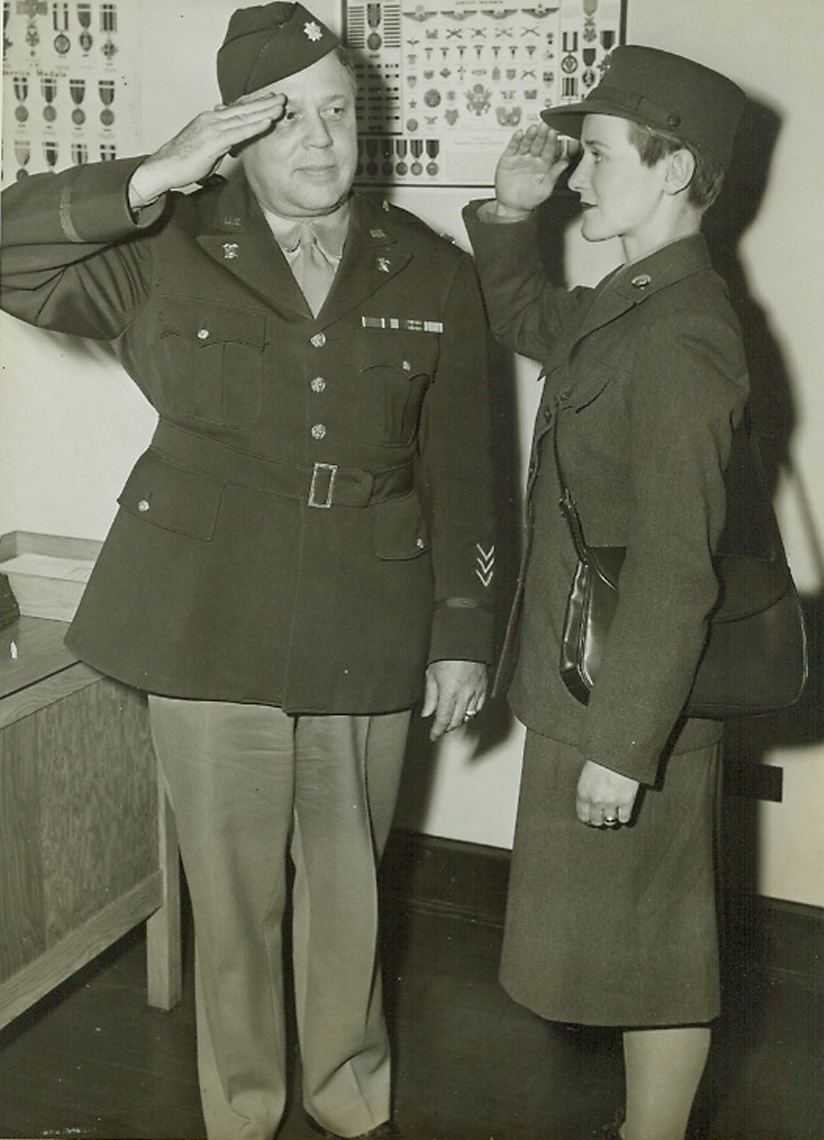 Hy, Pops!, 10/20/1942. Chicago—That may not be the way for a private to address a colonel, but that’s what miss Elizabeth Gage, a WAAC home from Fort Des Moines, Iowa, on furlough, said as she saluted her father Lt. Col. John Gage, executive officer of the Chicago Quartermaster Depot.Credit: ACME.;