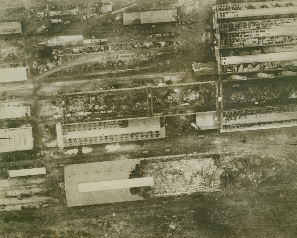 Breuil Steelworks Damaged in Krupps Raid, 11/10/1942. LE CREUSOT – The Breuil steelworks, one of three main sections of the steel-plants at Le Creusot, was blasted by the RAF on October 17. This reconnaissance photo shows the most severe damage to be: 1. Probably direct hit at the south end of steelworks, causing partial collapse of framework; 2. Severe blast damage to a shed adjoining the works; 3. Half a warehouse destroyed by a direct hit; 4. Severe blast damage to another warehouse.Credit Line (Acme);