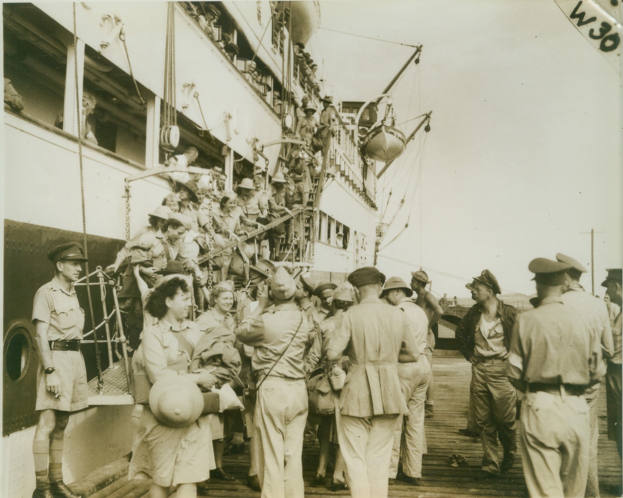 U.S. ARMY NURSES ARRIVE IN NEW GUINEA, 11/12/1942. NEW GUINEA – Eighteen U.S. Army nurses, the first white women to set foot in New Guinea since March 1942, arrive at an Allied advance base in the South Pacific stronghold. No other American nurses have been sent to the unnamed base, close to the fighting areas. Credit: ACME;