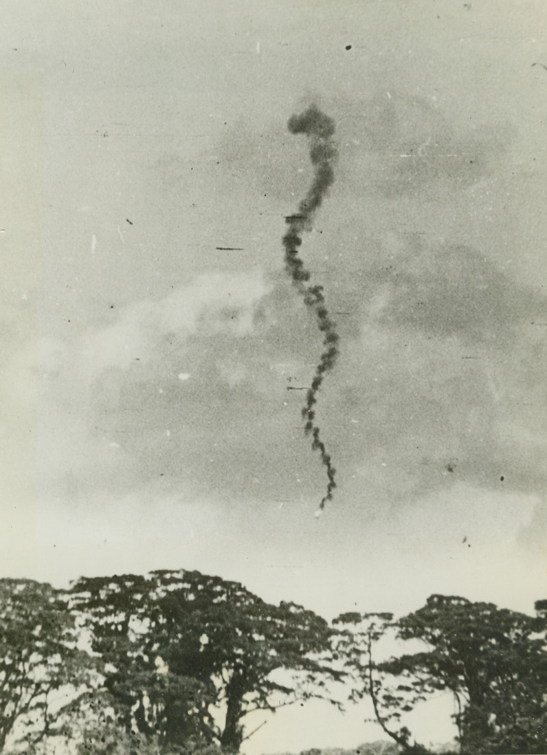 Jap Bomber Takes Death Dive, 11/11/1942. Guadalcanal: - A spiral of smoke trails a Jap bomber to the ground over Guadalcanal in the Solomon islands, after a raid which resulted in disaster for the attackers.  Lt. Gen. Thomas Holcomb, Marine Corps commandant who returned from an inspection trip of the Pacific battleground, announced American forces defending Guadalcanal outnumber the enemy on the island. Credit line (ACME);