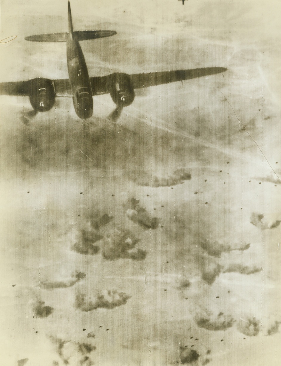 Laying Eggs, 11/6/1942. Cairo, Egypt – RAF Baltimores rained destruction on fleeing axis troops in the Western desert.  Photo radioed from Cairo shows one of the British planes “laying eggs” on retreating German vehicles.  Latest reports indicate heavy German losses and continued allied victories on the Egyptian front. Credit line (ACME);