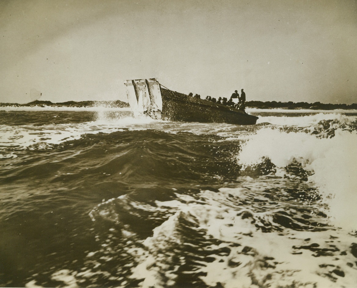 Over the Waves, 11/5/1942. New River, North Carolina -- Riding high on the waves, a Higgins Landing Boat carries armed Marines to the beach for assault action during a part of the intensive training course given at the U.S. Marine base at New River, in the Marine’s Advanced School of Combat Techniques. Passed by censor. Credit: ACME;