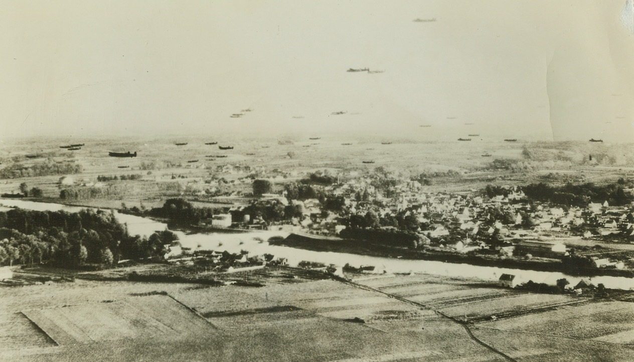Armada of “Lancasters”, 11/10/1942. This unusual photo shows an armada of huge RAF “Lancaster” four-motored bombers as they roared over the village of Mon Richard in France, on their way to blast the Schneider Works at Le Creusot, last October 17. Each of the ships carried almost nine tons of bombs and flew at less than 300 feet to cause tremendous damage to the motor works, which was building equipment for Nazi tanks and planes. Passed by censors. Credit: ACME;