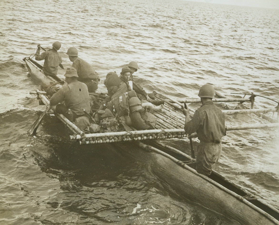 IMAGINATION ESSENTIAL, 12/8/1942. NEW GUINEA—American Troops go canoeing native style as they head into midstream to board small boats that will take them down an un-named river to the forward position of a native village. The boats they are about to board each hold 100 men and moved many fighting units toward the beleaguered Jap troops.Credit: ACME.;