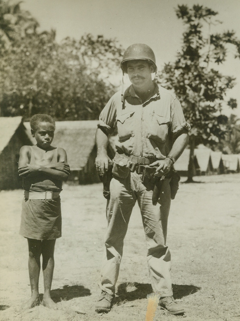 Guadalcanal’s Gunga Din”, 12/23/1942. Guadalcanal – U.S. Marines on Guadalcanal Nicknamed this diminutive native boy, “Gunga din”.  He was on a recent patrol action against the Japanese. Credit line (ACME);