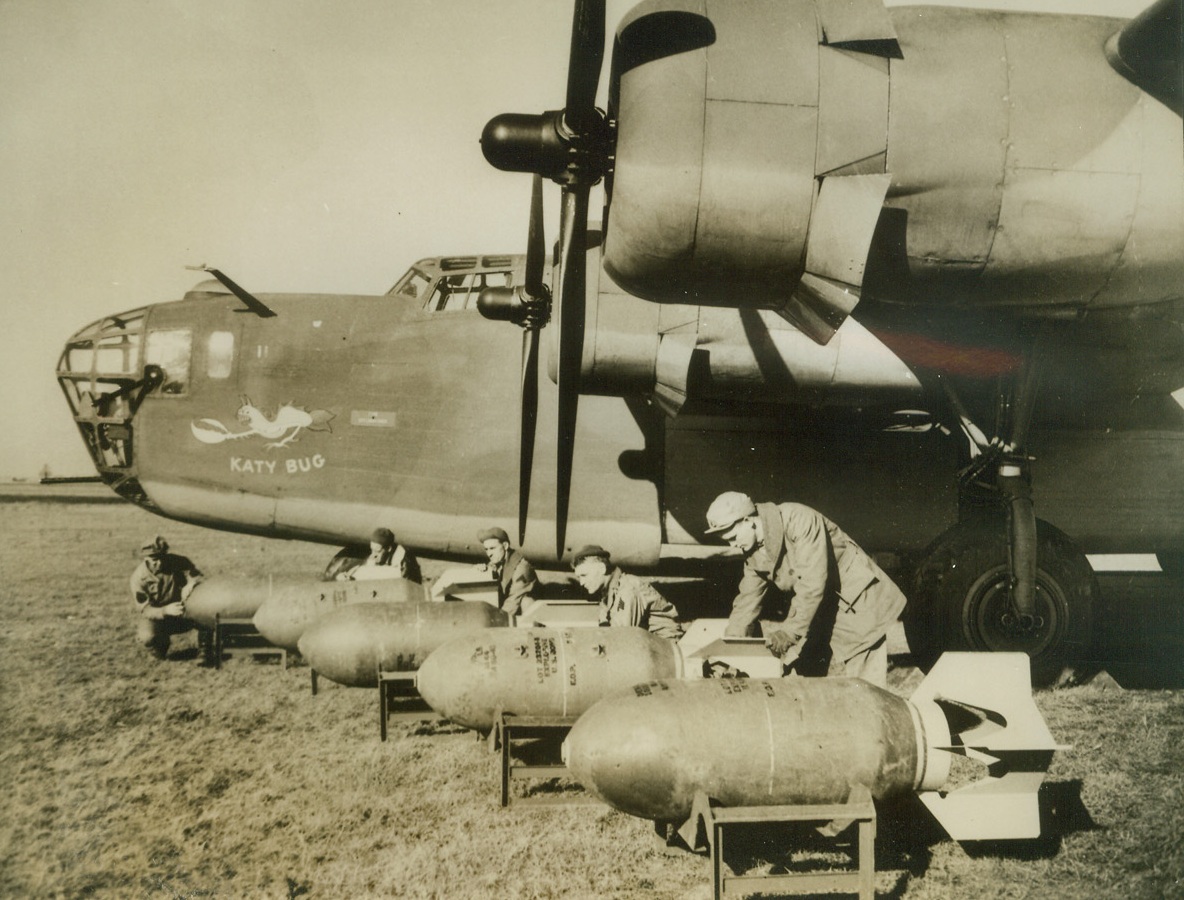 First Pictures of American Bombs in Britain, 12/11/1942. England—This is one of the first photos of the American-made 1,000 pounds bombs that are now being sent to the Axis on American “liberators,” manned by American crews. The famed giant “Liberator” is the same type plane that took Churchill to Russia and the Near East and participated in the daylight attacks on Lille. Credit: ACME;