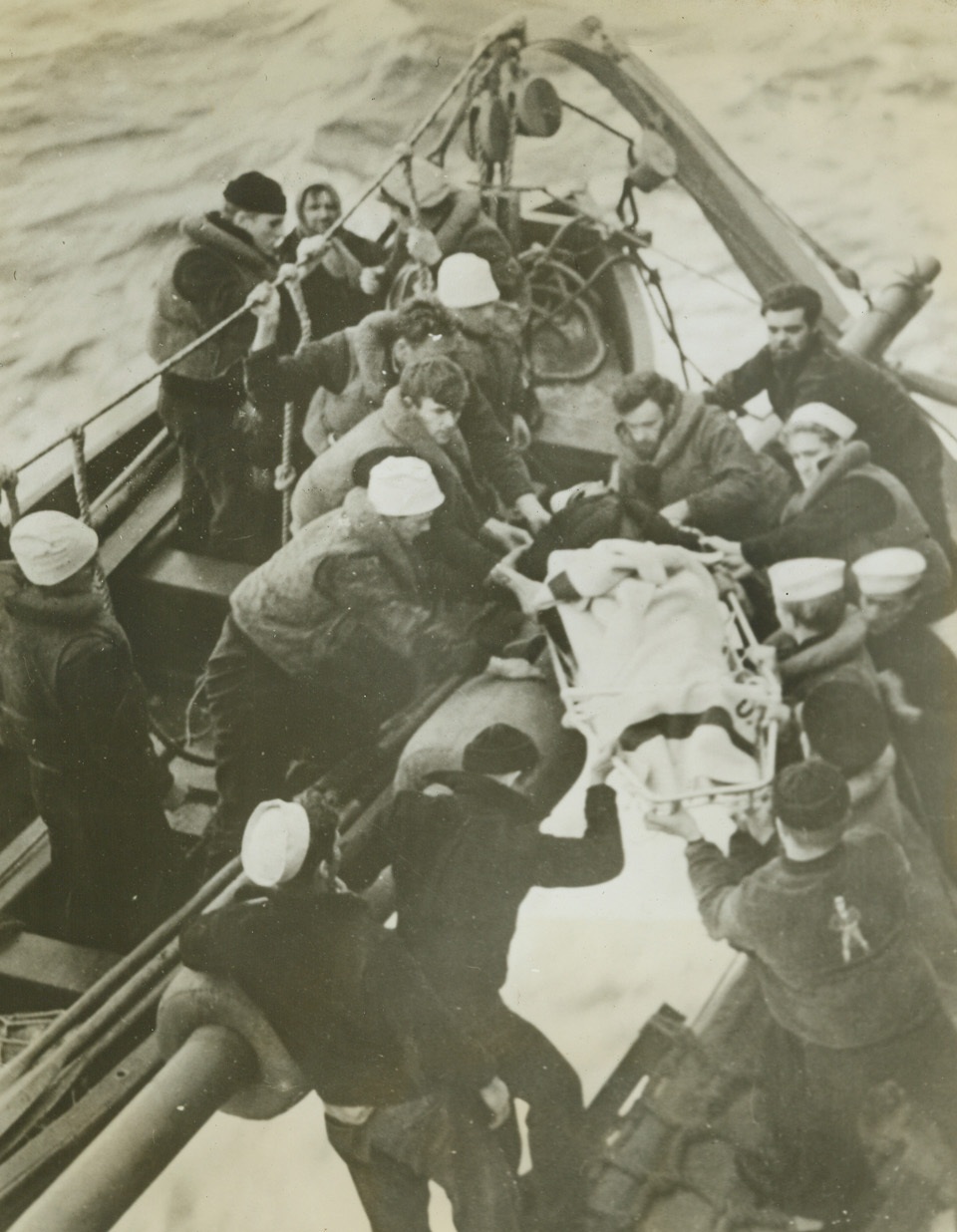 Agents of Mercy, 12/31/1942. Somewhere on the North Atlantic—Picked from the sea, the survivors of a torpedoed British merchant ship are made as comfortable as possible aboard a U.S. Coast Guard cutter. They were given immediate hospital treatment by Coast Guardsmen and taken to a friendly port. Passed by censor. Credit: U.S. Coast Guard photo from ACME.;