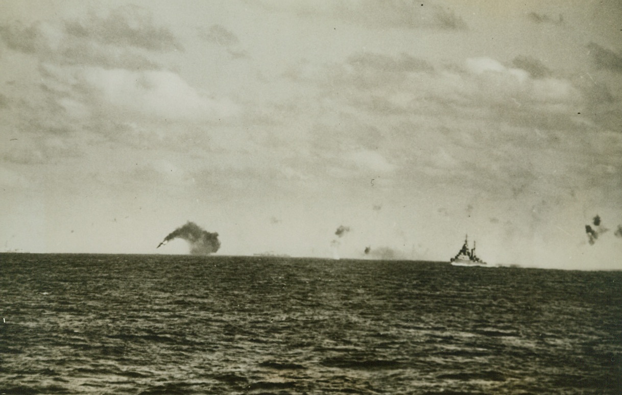 Italian Bomber Goes Down in Flames, 2/28/1942. Trailing dense black smoke, an Italian Savoia torpedo bomber plunges toward the surface of the Mediterranean, shot down during a 5-hour-long raid on a British convoy by Italian and German planes. The sky is pock-marked with puffs of smoke from the antiaircraft fire from the British escorting warships which ultimately drove off the attackers. Convoy and warships were undamaged.Credit: (ACME);