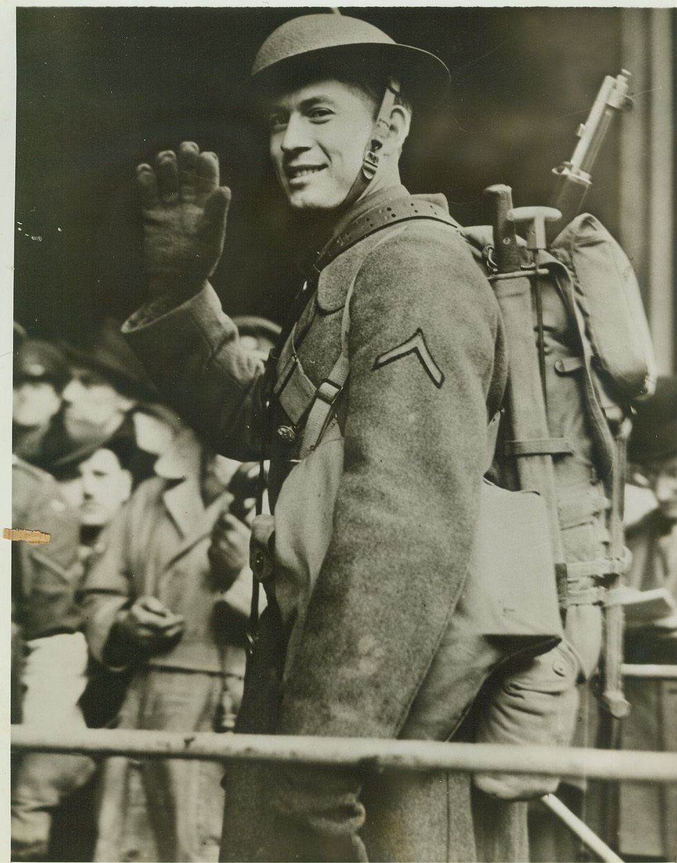 First American Soldier Lands in Ireland, 2/8/1942. NORTHERN IRELAND -- Pvt. Milburn Henke, of Hutchinson, Minn., waves as he walks ashore in Northern Ireland, first American soldier to set foot on British Island soil during World War II. He was selected at random from the ranks by the commanding officer of the expeditionary force, Maj. Gen. Russell P. Hartle. Credit: (ACME);