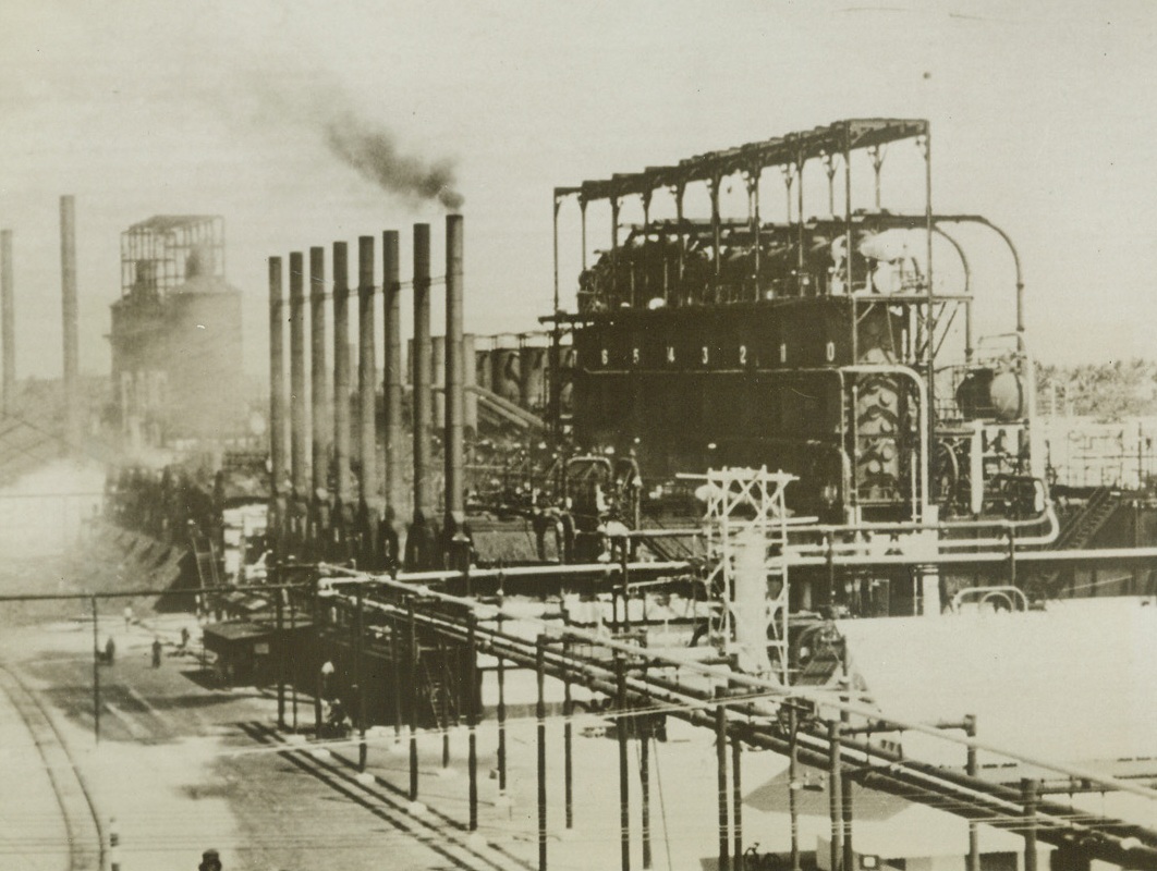 Japs Want This, 2/15/1942. Netherlands East Indies – View of the huge standard oil company’s plant in the oil refining area of Palembang in Sumatra, which is threatened by the landing of Jap troops in Southern Sumatra today for a land drive on Pelembang, 60 miles inland.  It was assumed that the Netherlanders would not hesitate to apply their scorched-Earth policy to the refineries and oil fields, representing an investment of hundreds of millions of dollars, if plant actually became endangered by the invaders. Credit line (from March of Time’s far East command from ACME)Netherlands East Indies – View of the huge standard oil company’s plant in the oil refining area of Palembang in Sumatra, which is threatened by the landing of Jap troops in Southern Sumatra today for a land drive on Pelembang, 60 miles inland.  It was assumed that the Netherlanders would not hesitate to apply their scorched-Earth policy to the refineries and oil fields, representing an investment of hundreds of millions of dollars, if plant actually became endangered by the invaders. Credit line (from March of Time’s far East command from ACME);