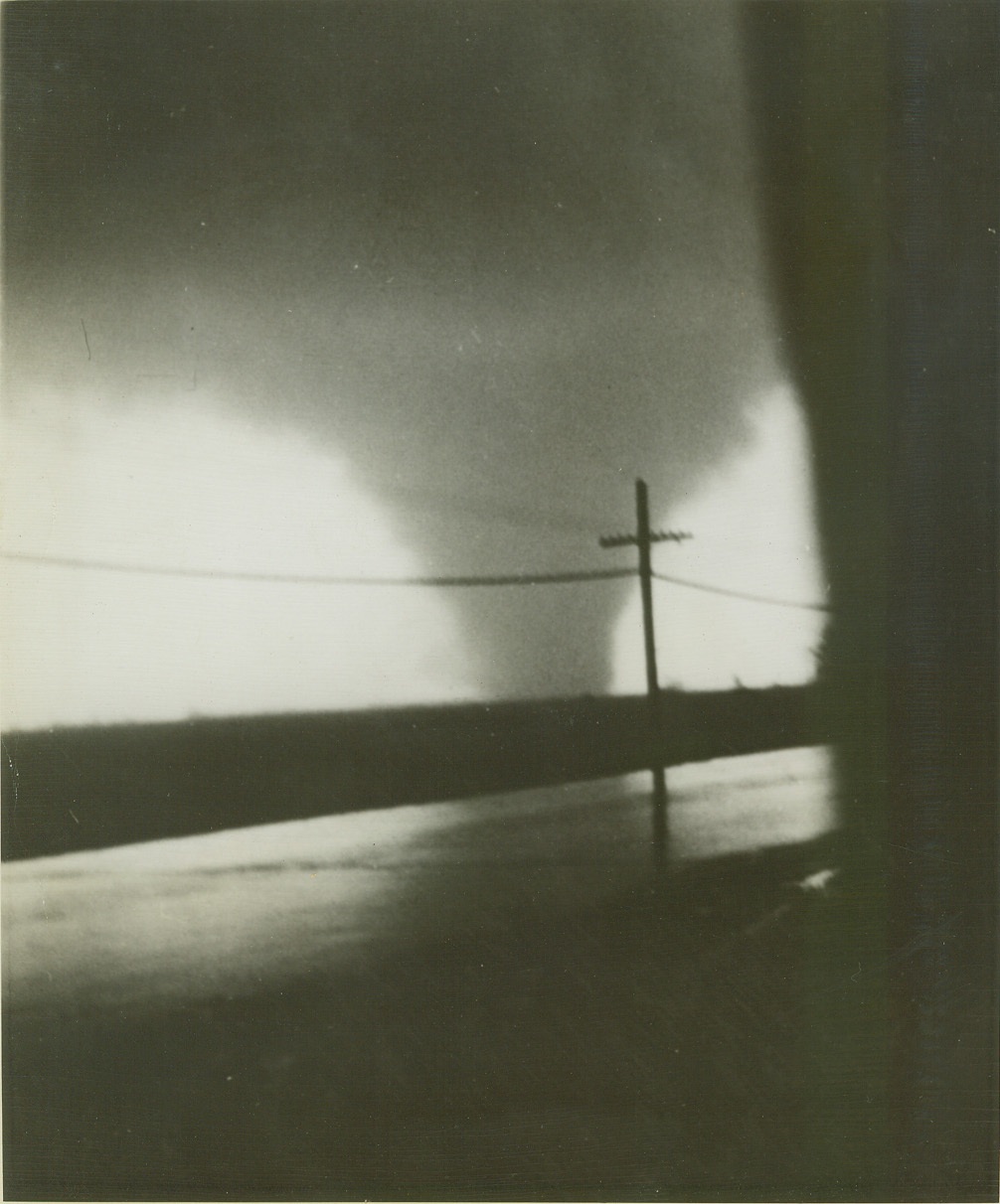 FUNNEL OF DEATH, 3/19/1942. DANVILLE, ILL. – A. J. Weber of Collinsville, Ill., shot this photo of a twister as it approached Illinois Highway No. 1 North of Danville, Ill., on its sweep across several counties, leaving death and destruction in its wake. It was one of the tornadoes that struck the Midwest from Illinois to Mississippi March 16, killing over 150 persons, injuring nearly 1,000. Credit: ACME photo;